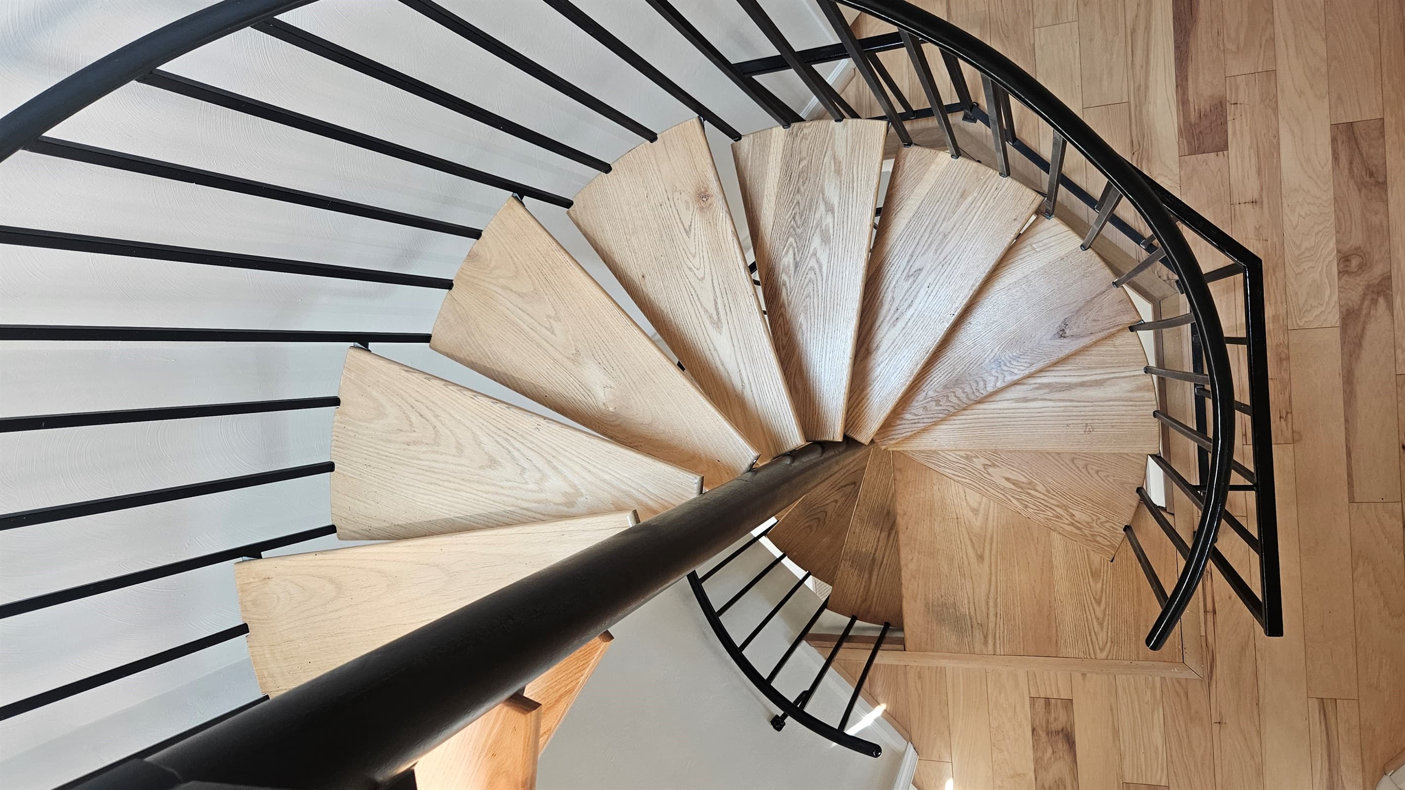 Spiral stairs connect the interior levels of the entire home