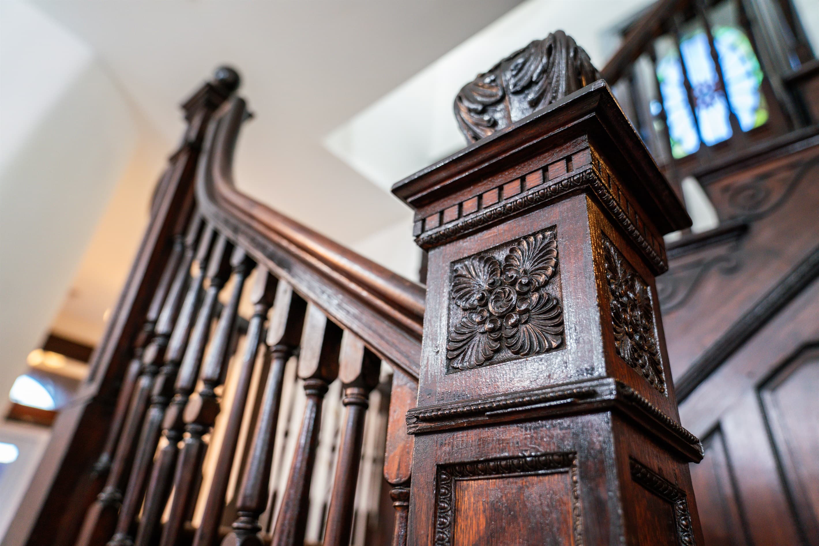 Admire the original hand-carved details in the staircase that's over 130 years old!