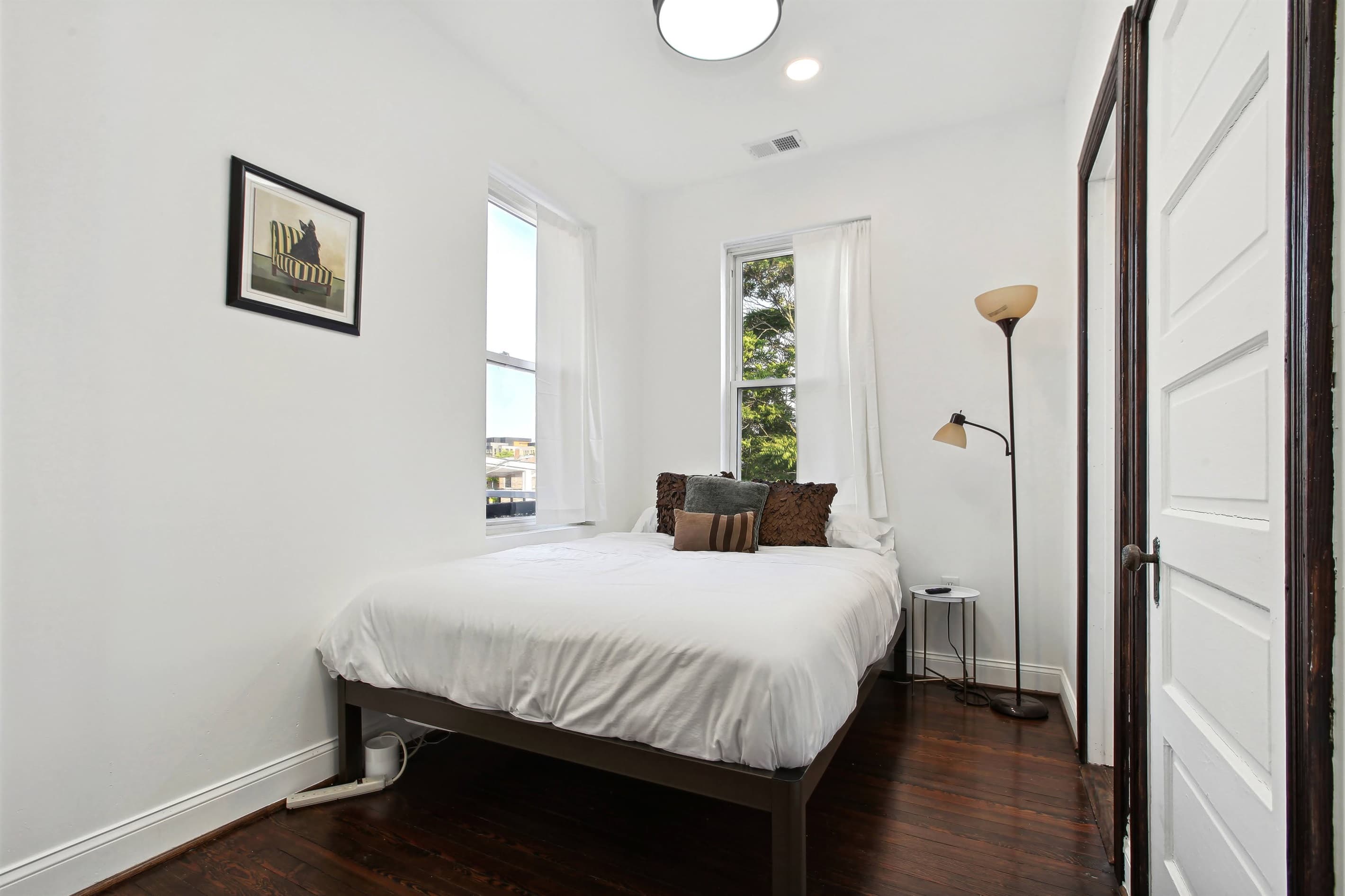 Bedroom #5 upstairs has a queen bed and shares a jack and jill bathroom with bedroom #4