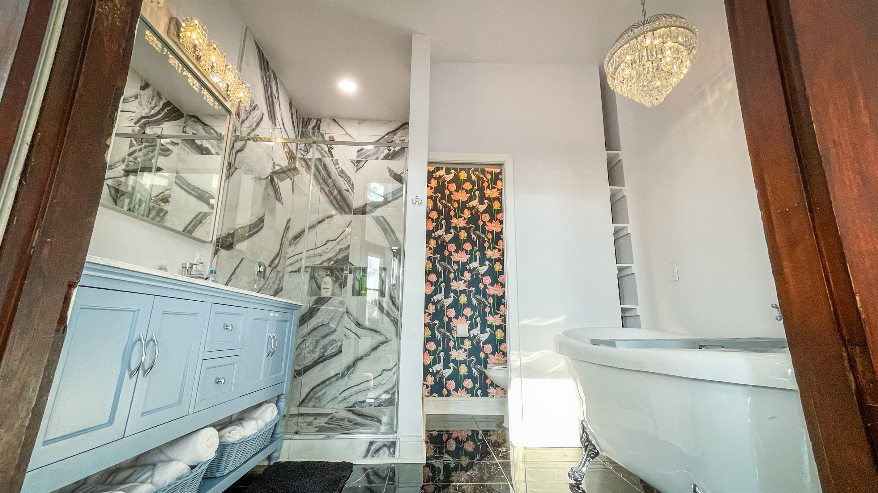 Enjoy the marble double vanity, the shower with 2 showerheads, toilet room, and jetted clawfoot tub in the primary en-suite bathroom