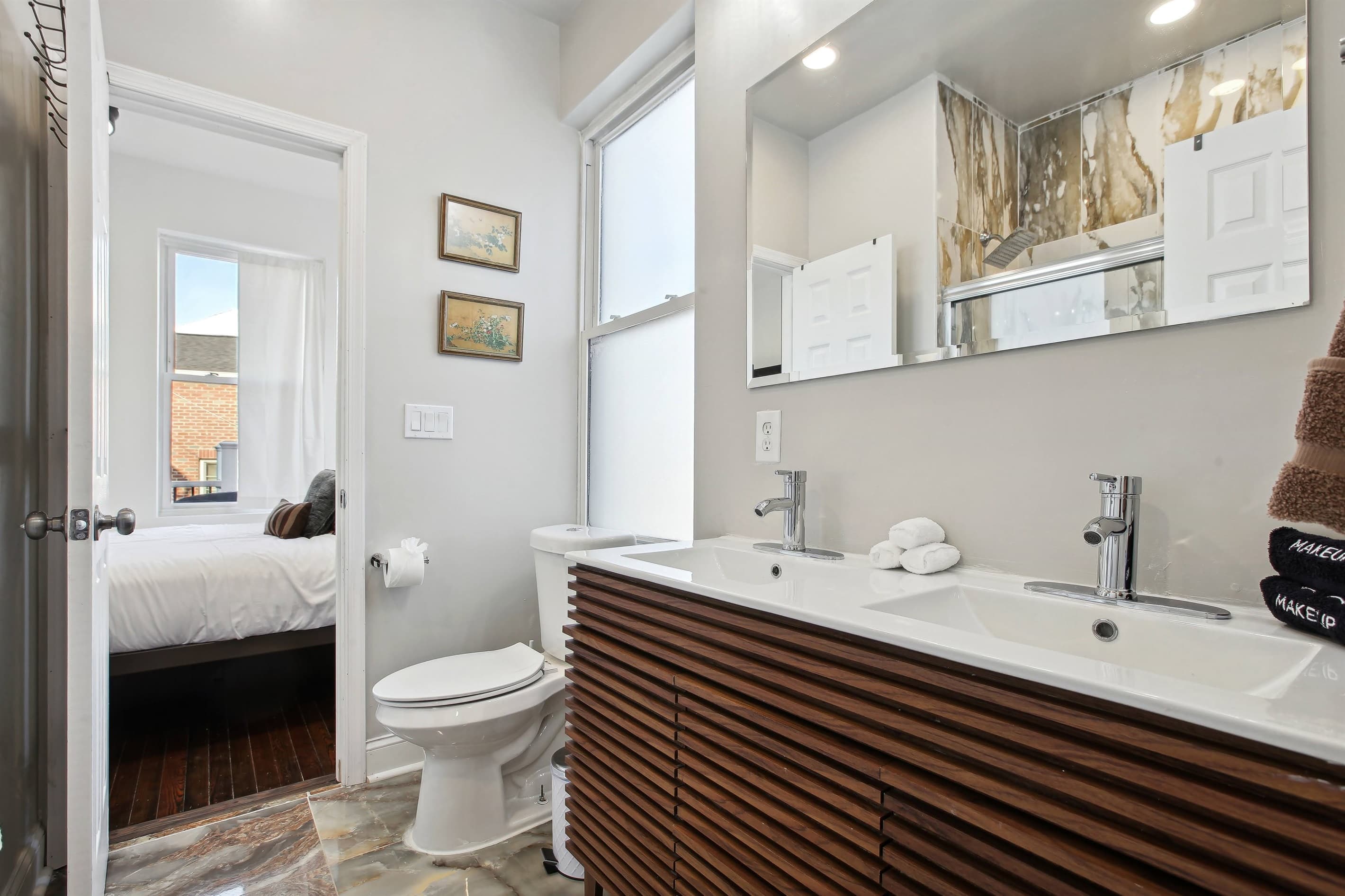 This upstairs jack and jill bathroom is in the rear of the house and is shared by bedrooms #4 and #5