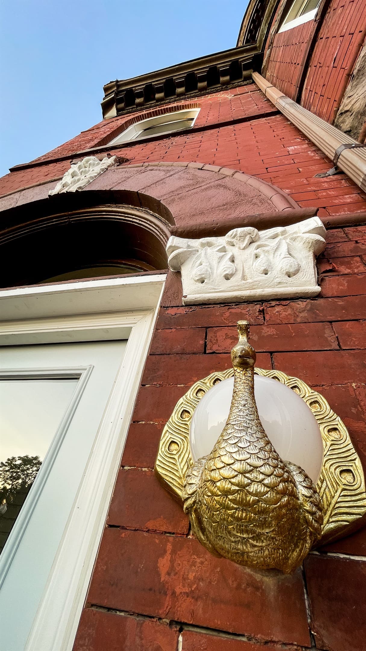 The house has been renovated with gold accents and details throughout
