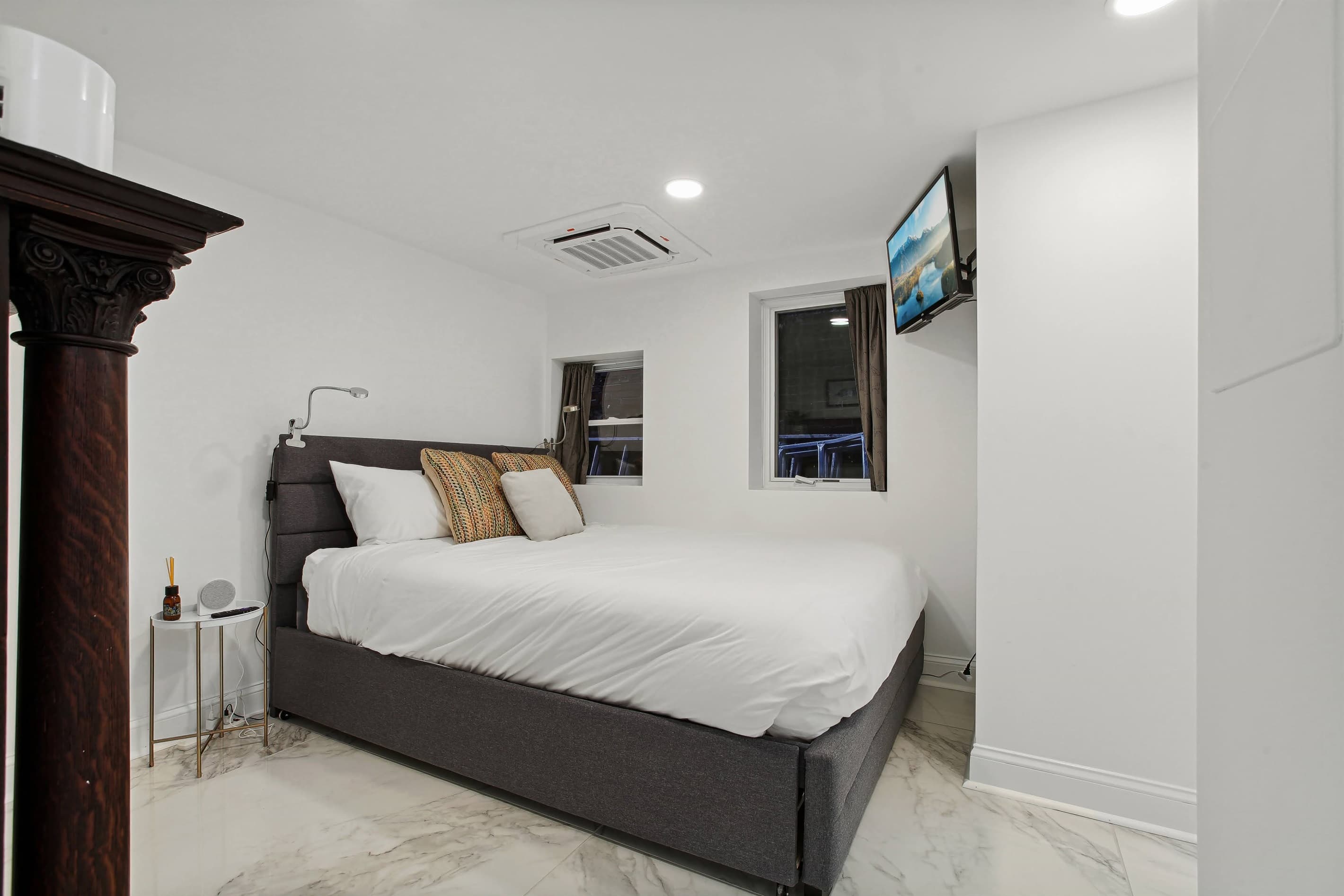 The primary bedroom has a queen bed and a twin trundle bed below