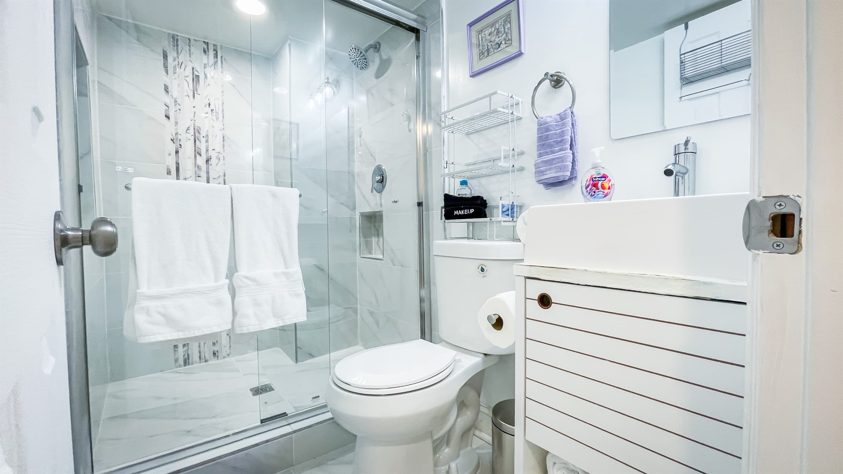 The primary bedroom has an en-suite bathroom with a walk-in shower