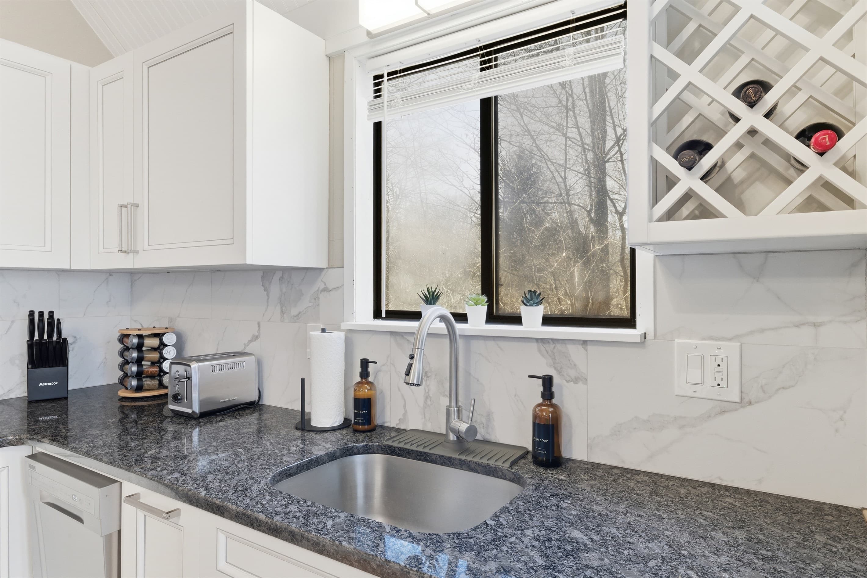 Kitchen with stainless steel appliances and granite countertops - Serhii Chalet Pocono