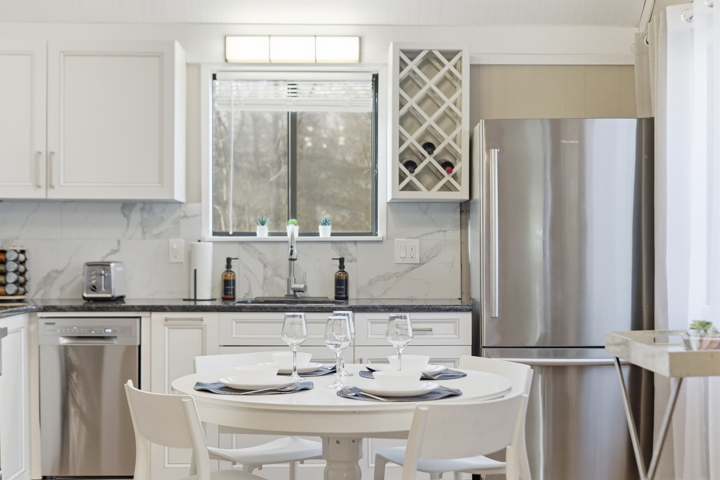 Kitchen with stainless steel appliances and granite countertops - Serhii Chalet Pocono