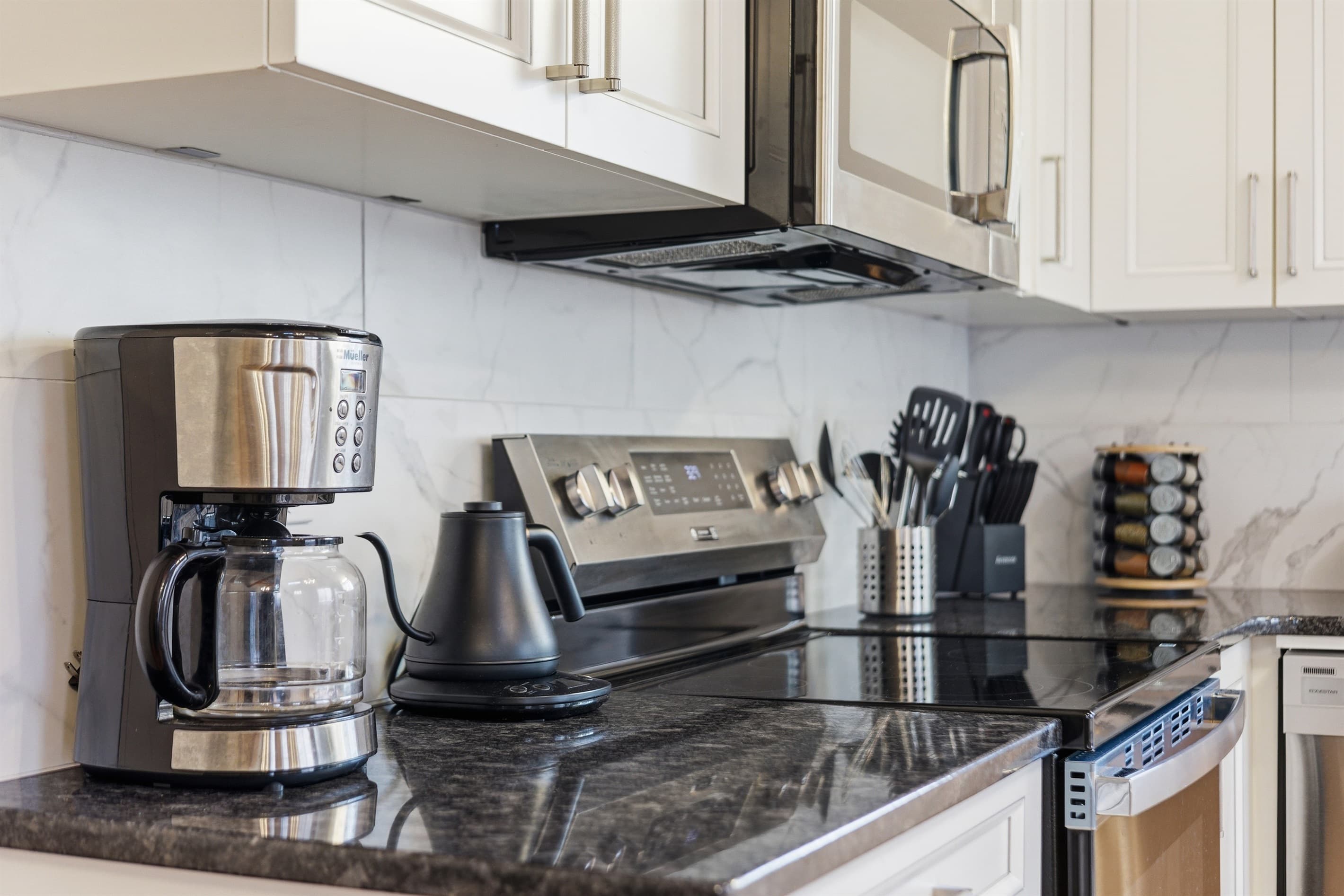 Kitchen with stainless steel appliances and granite countertops - Serhii Chalet Pocono