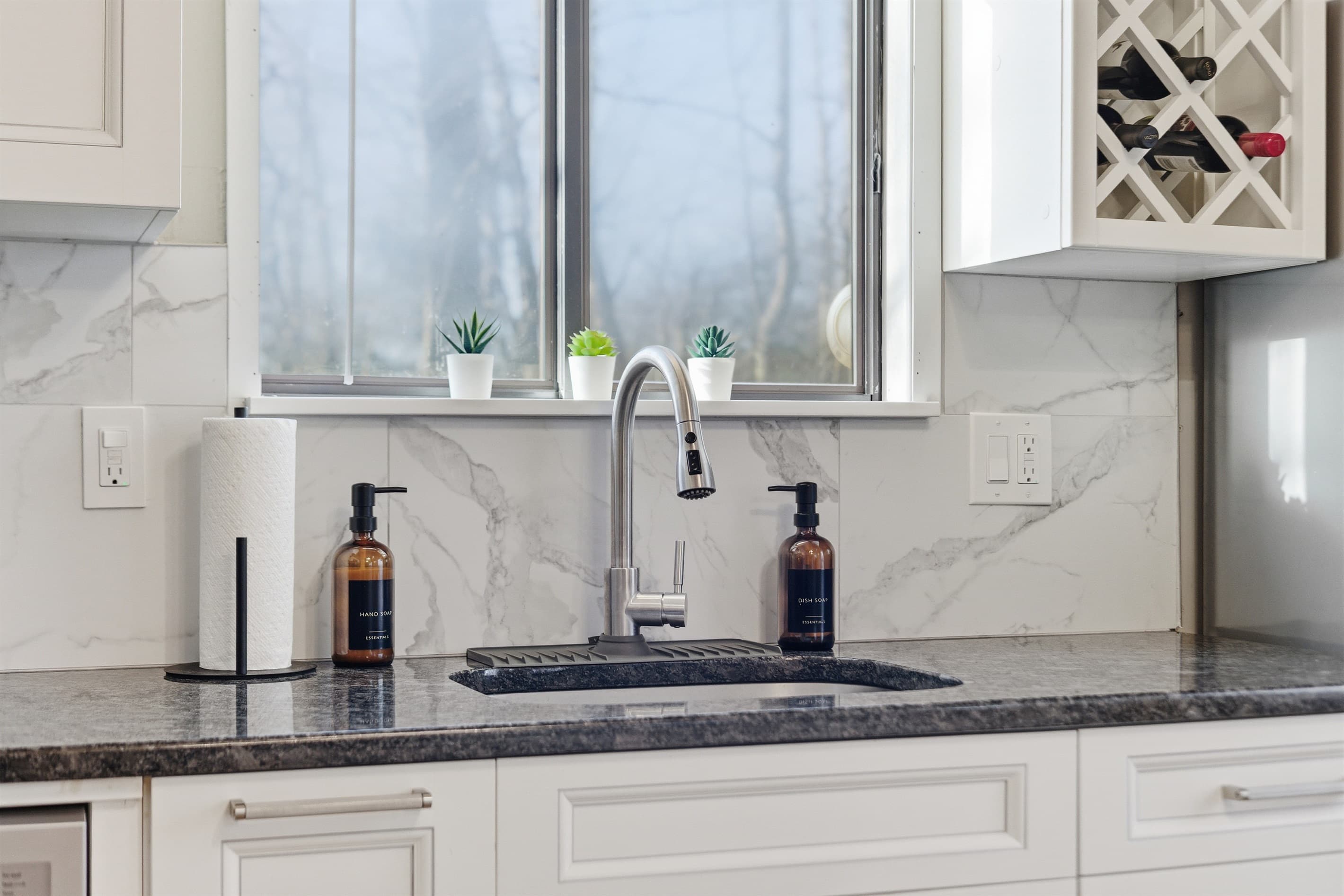 Kitchen with stainless steel appliances and granite countertops - Serhii Chalet Pocono