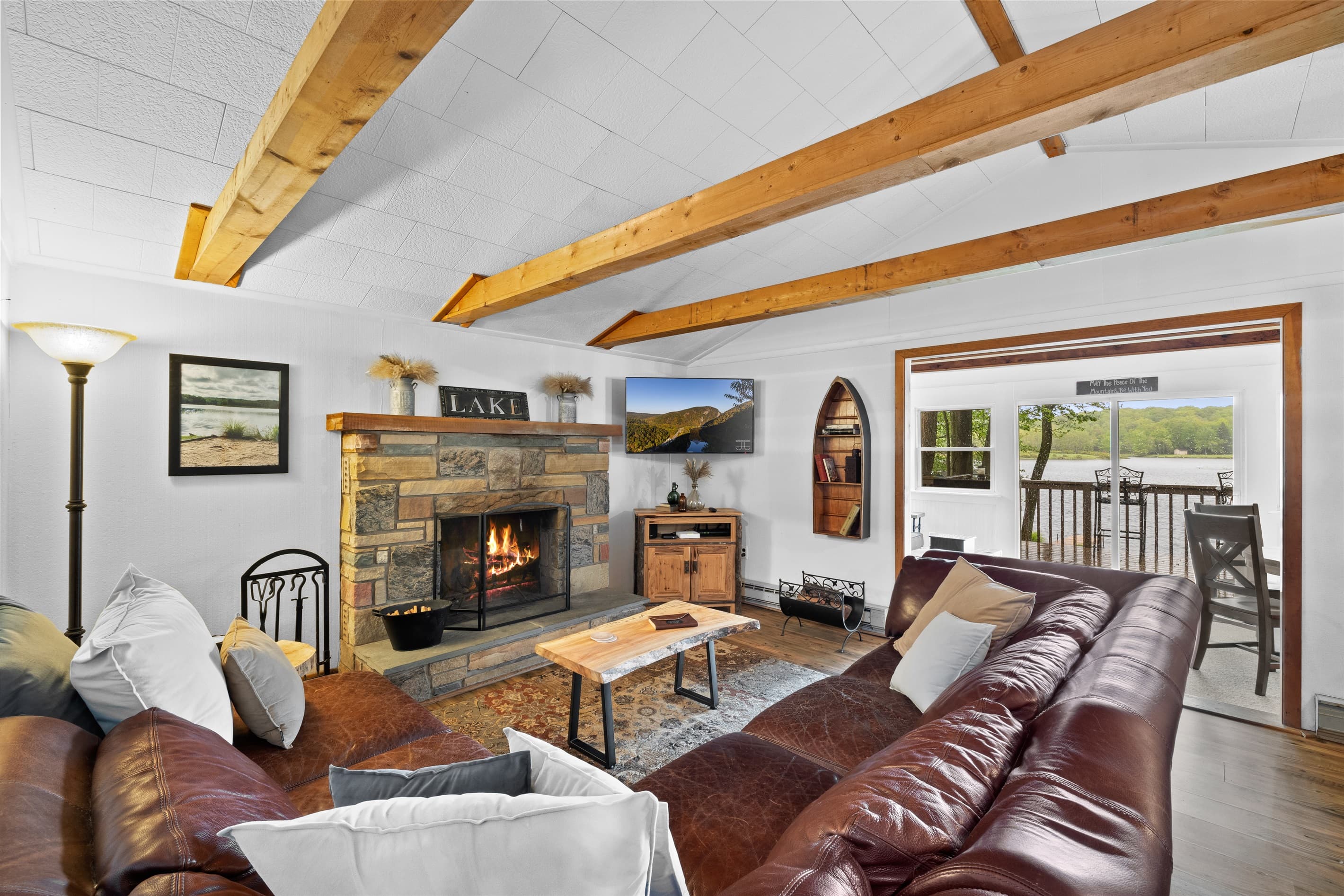 Living room with wood burning fireplace, Smart TV and seating