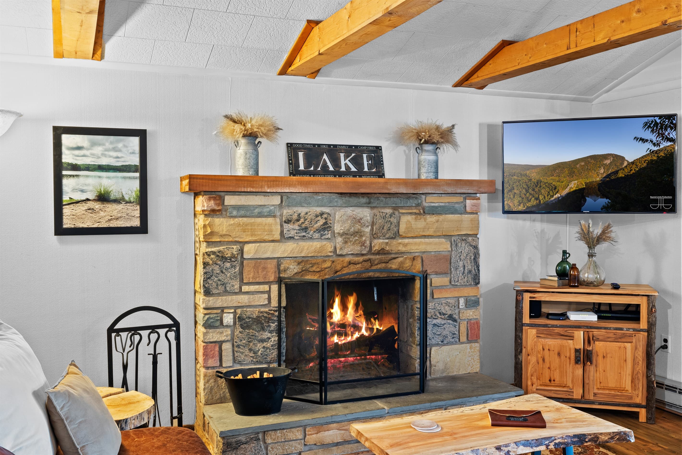 Living room with wood burning fireplace, Smart TV and seating