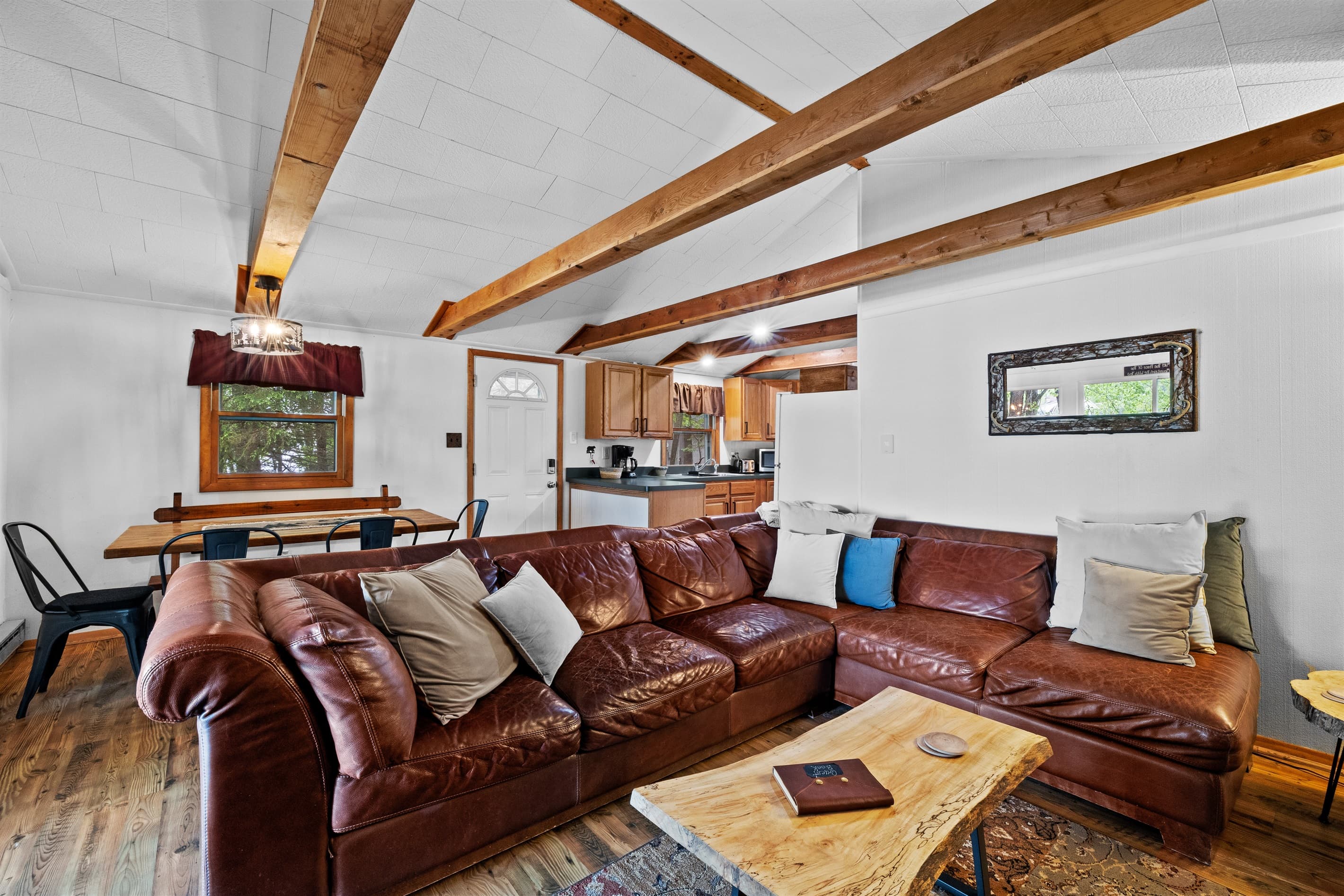 Living room with wood burning fireplace, Smart TV and seating