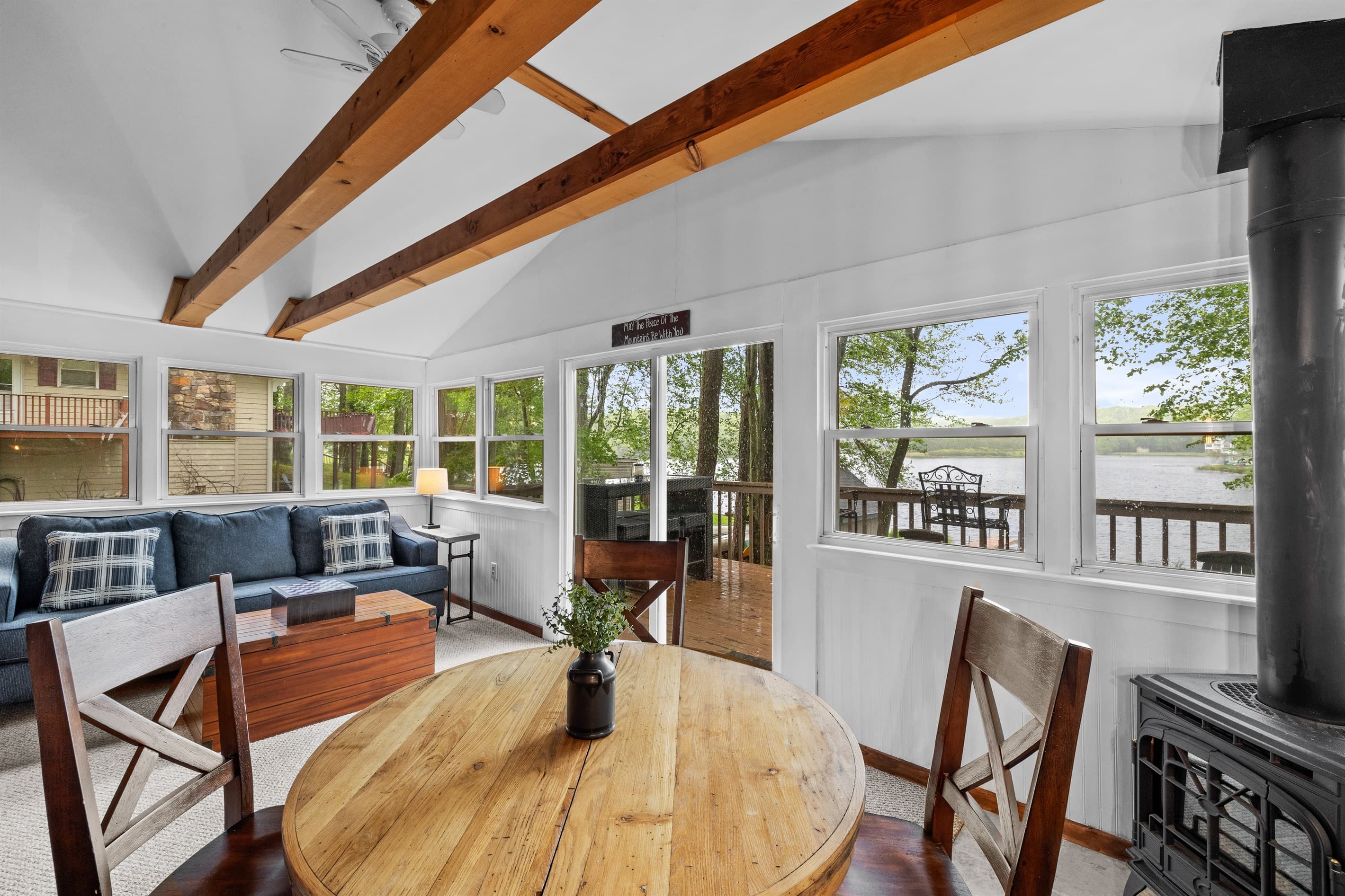 Sunroom with a lake view