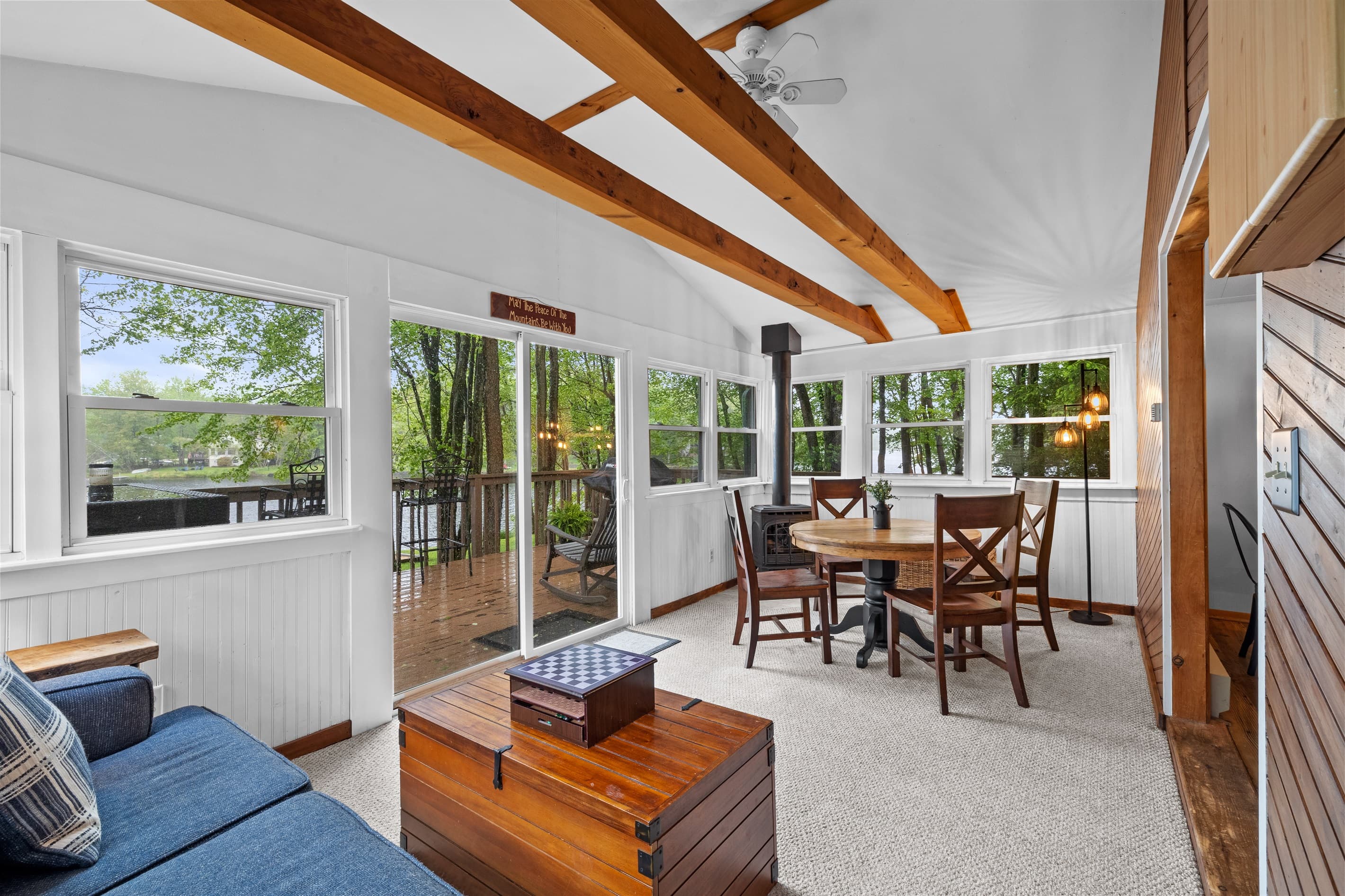 Sunroom with a lake view