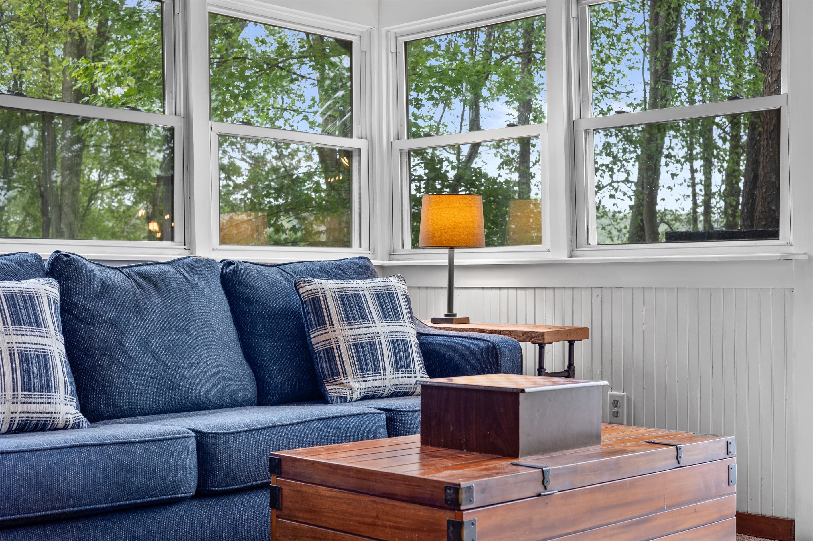 Sunroom with a lake view