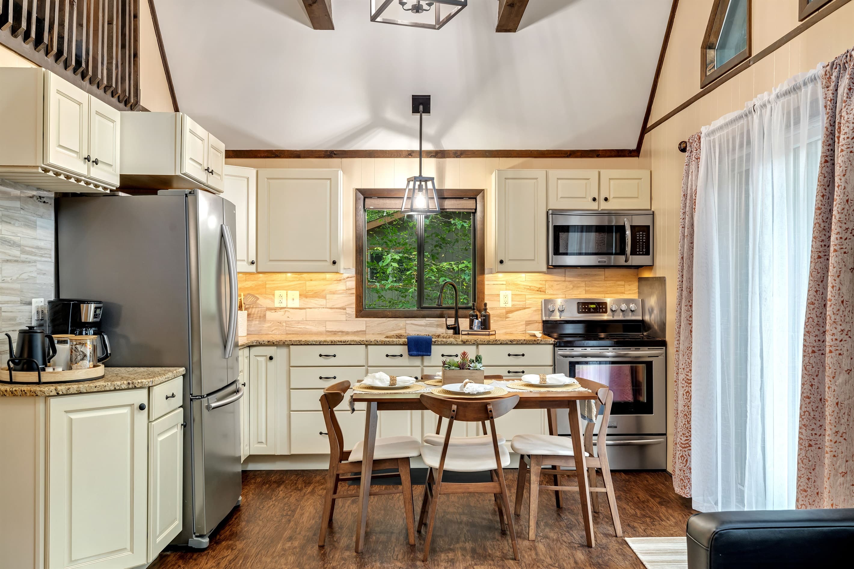Modern kitchen with stainless steel appliances and granite countertops