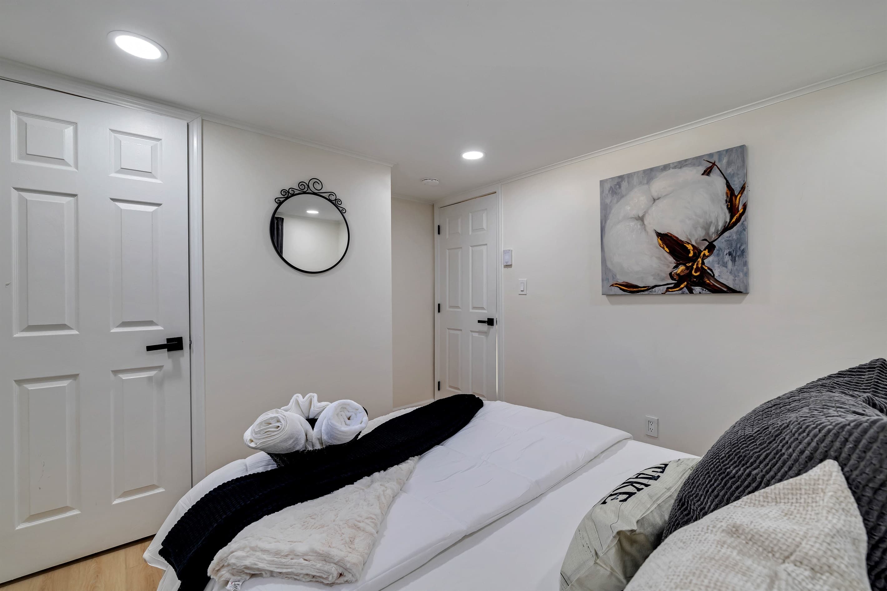 Bedroom with queen bed and closet