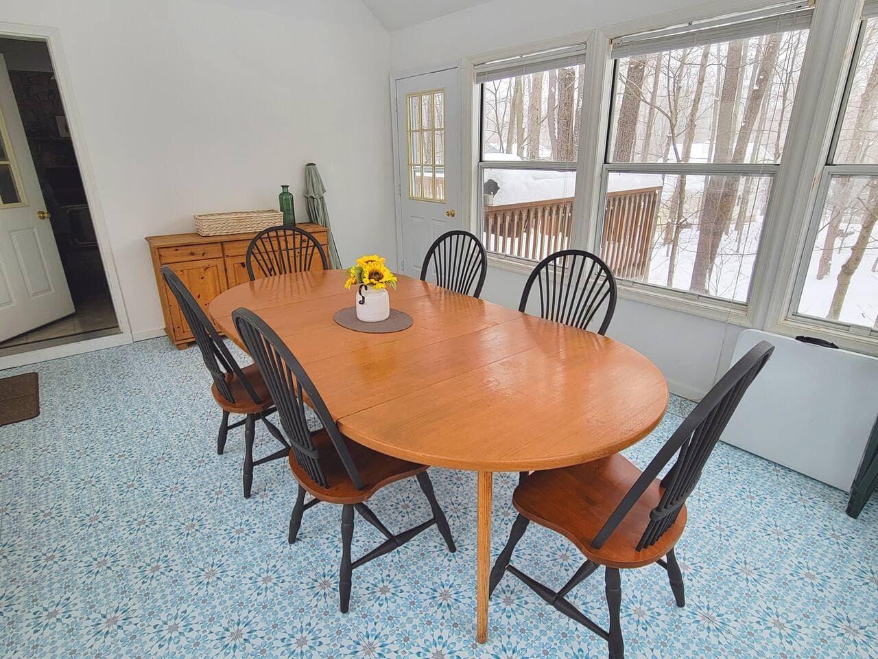 Dining table in the sunroom with seating