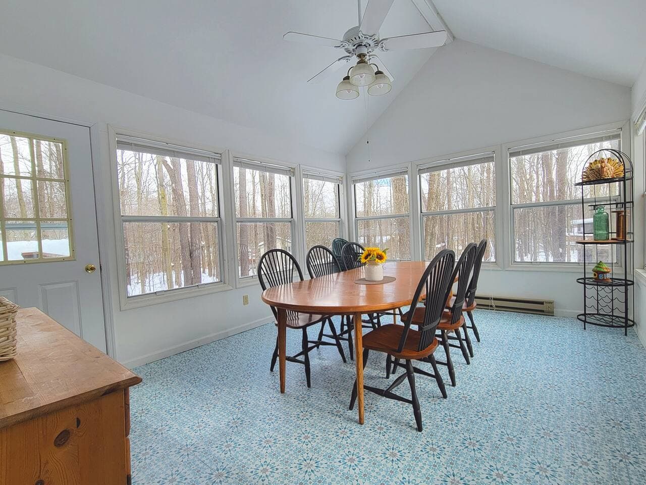 Dining table in the sunroom with seating