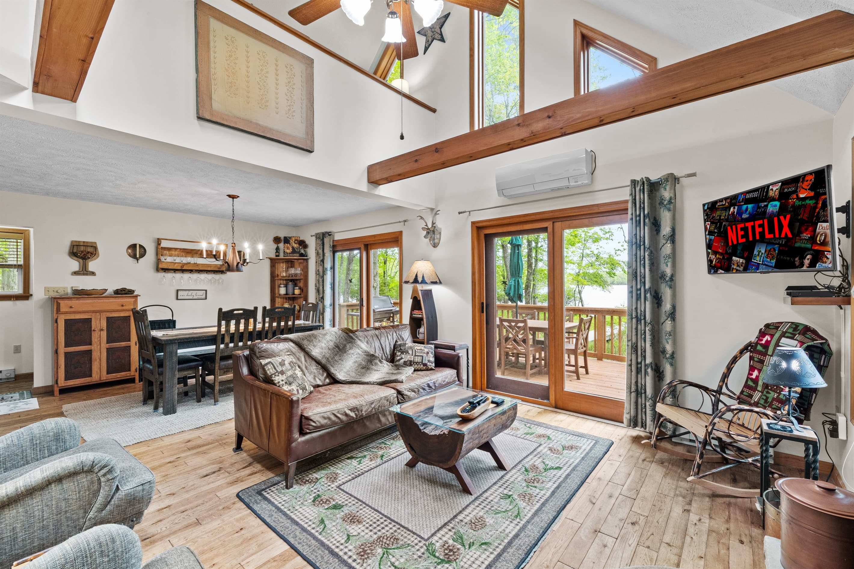 Living room with wood burning fireplace, TV and comfortable seating