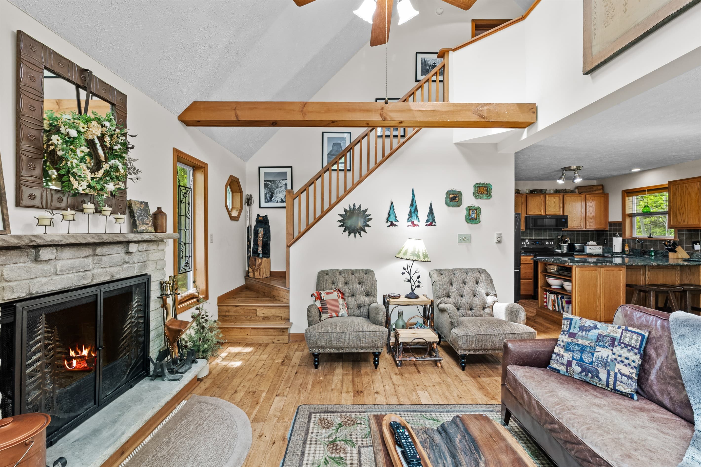 Living room with wood burning fireplace, TV and comfortable seating