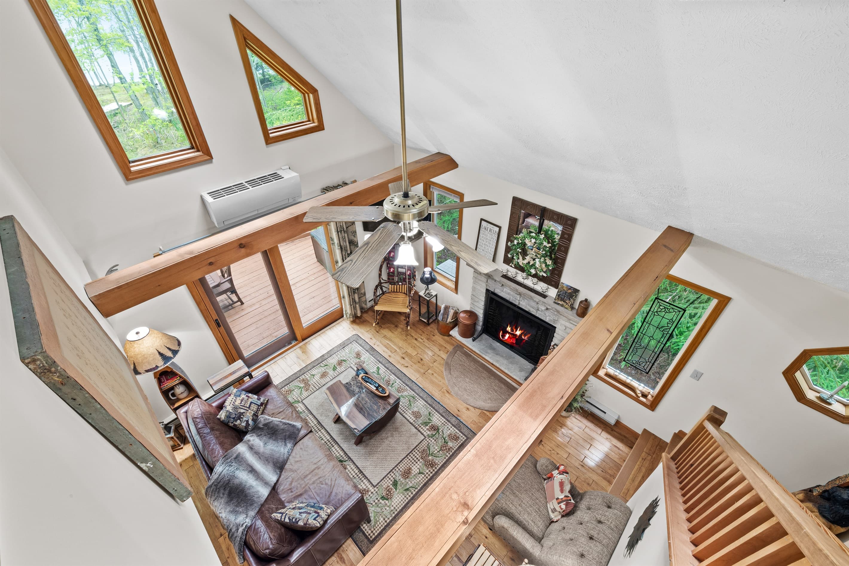 Living room with wood burning fireplace, TV and comfortable seating