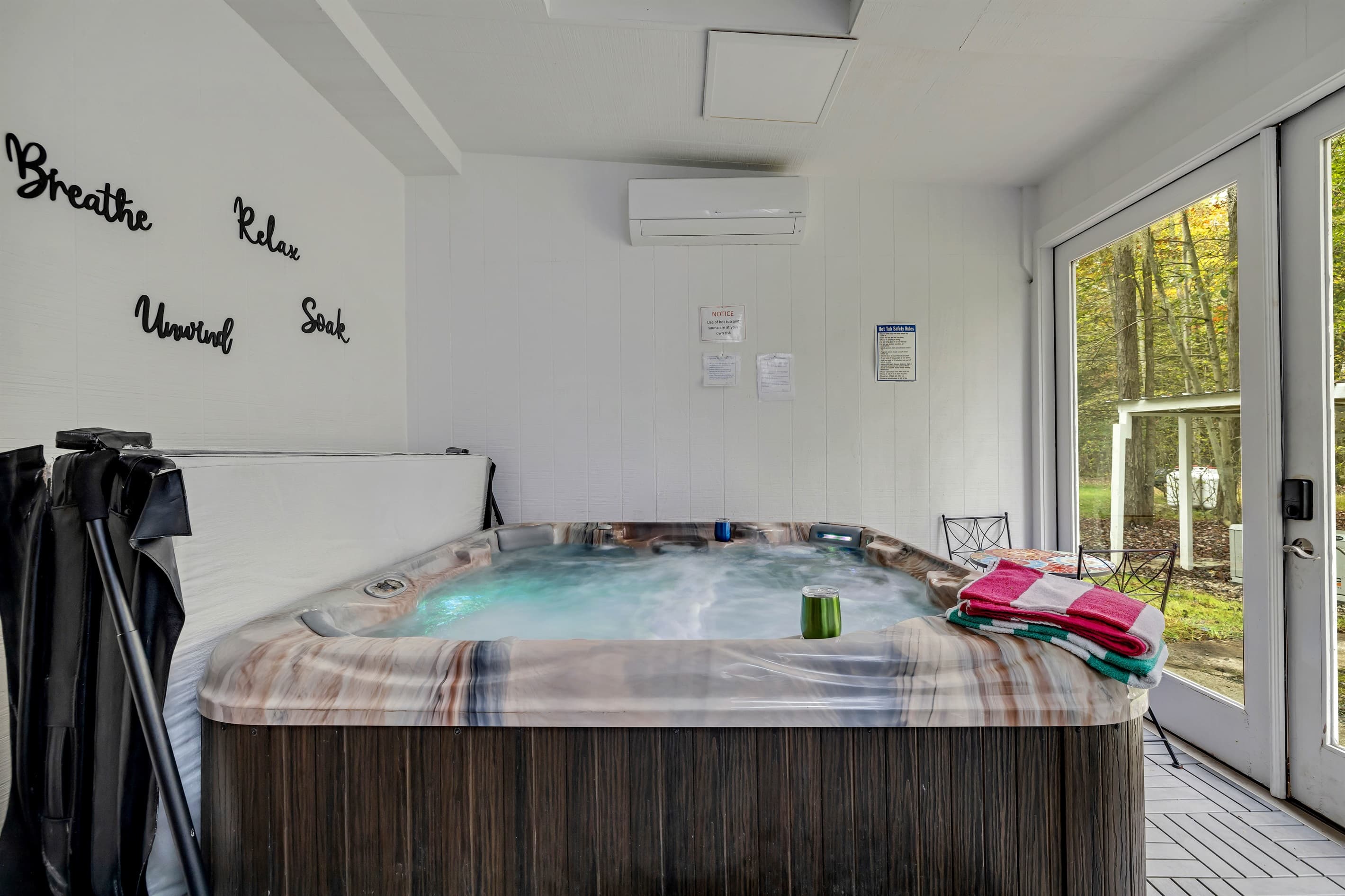 Unwind in the ultimate relaxation space with a private 2-person sauna and a soothing hot tub, perfect for rejuvenation.