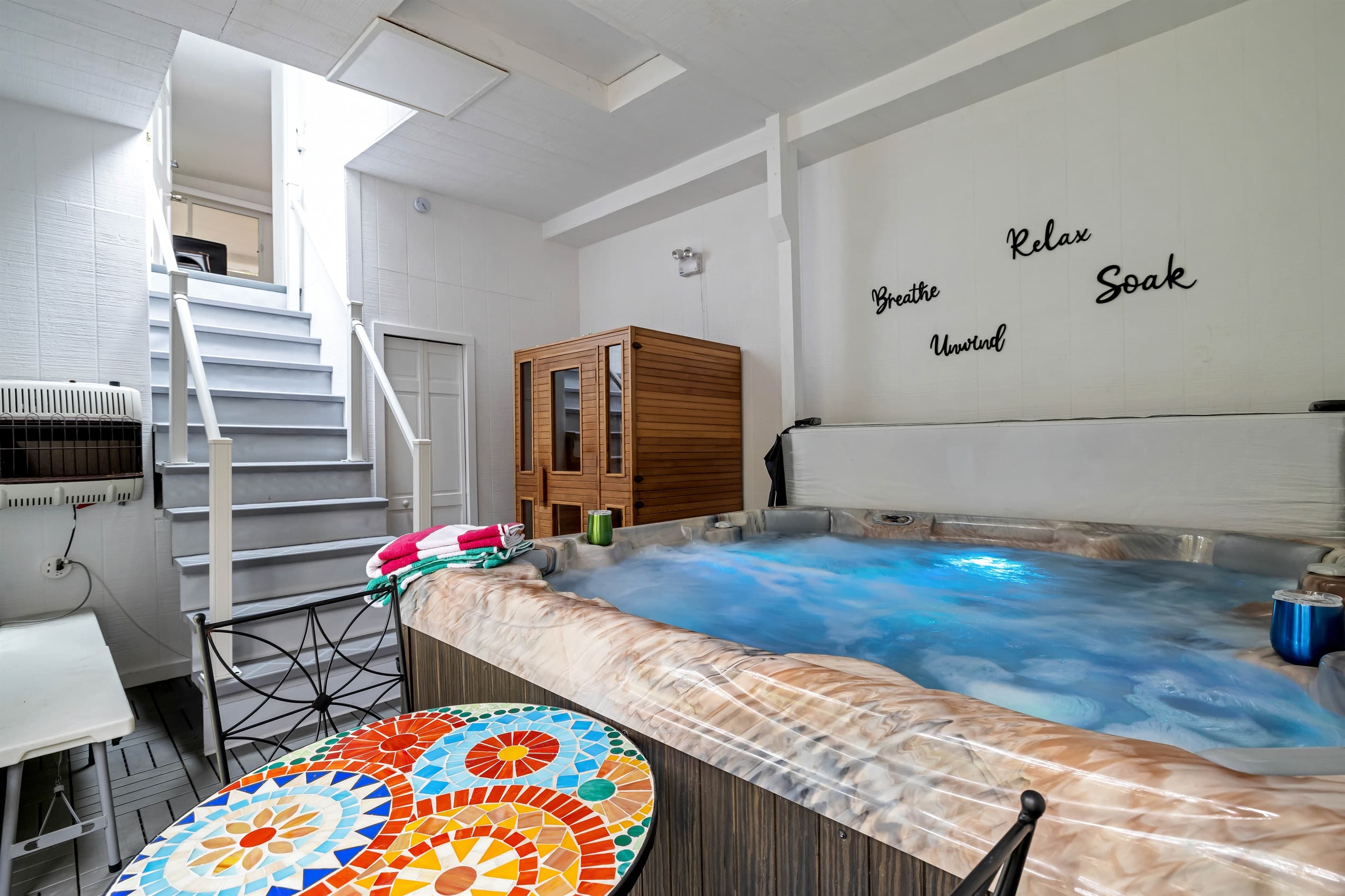 Pocono mountains rental | Unwind in the ultimate relaxation space with a private 2-person sauna and a soothing hot tub, perfect for rejuvenation.