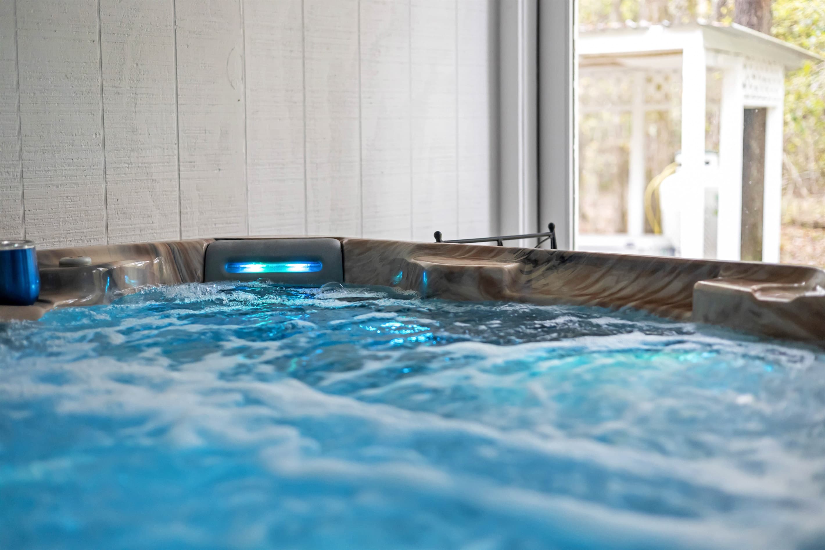 Unwind in the ultimate relaxation space with a private 2-person sauna and a soothing hot tub, perfect for rejuvenation.