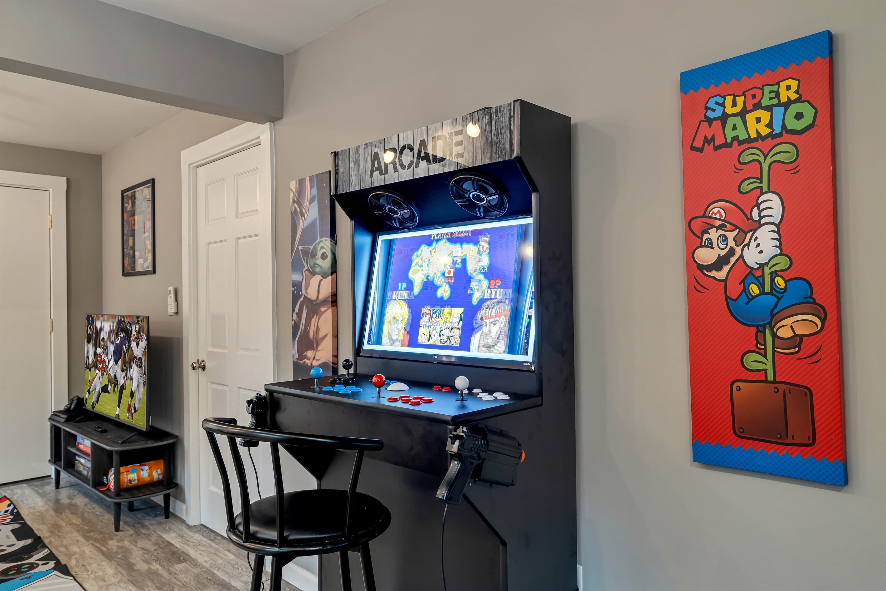 The game room is a fun-filled space with a foosball table, PS4, TV, darts, arcade games, and a variety of board games, perfect for entertainment and relaxation