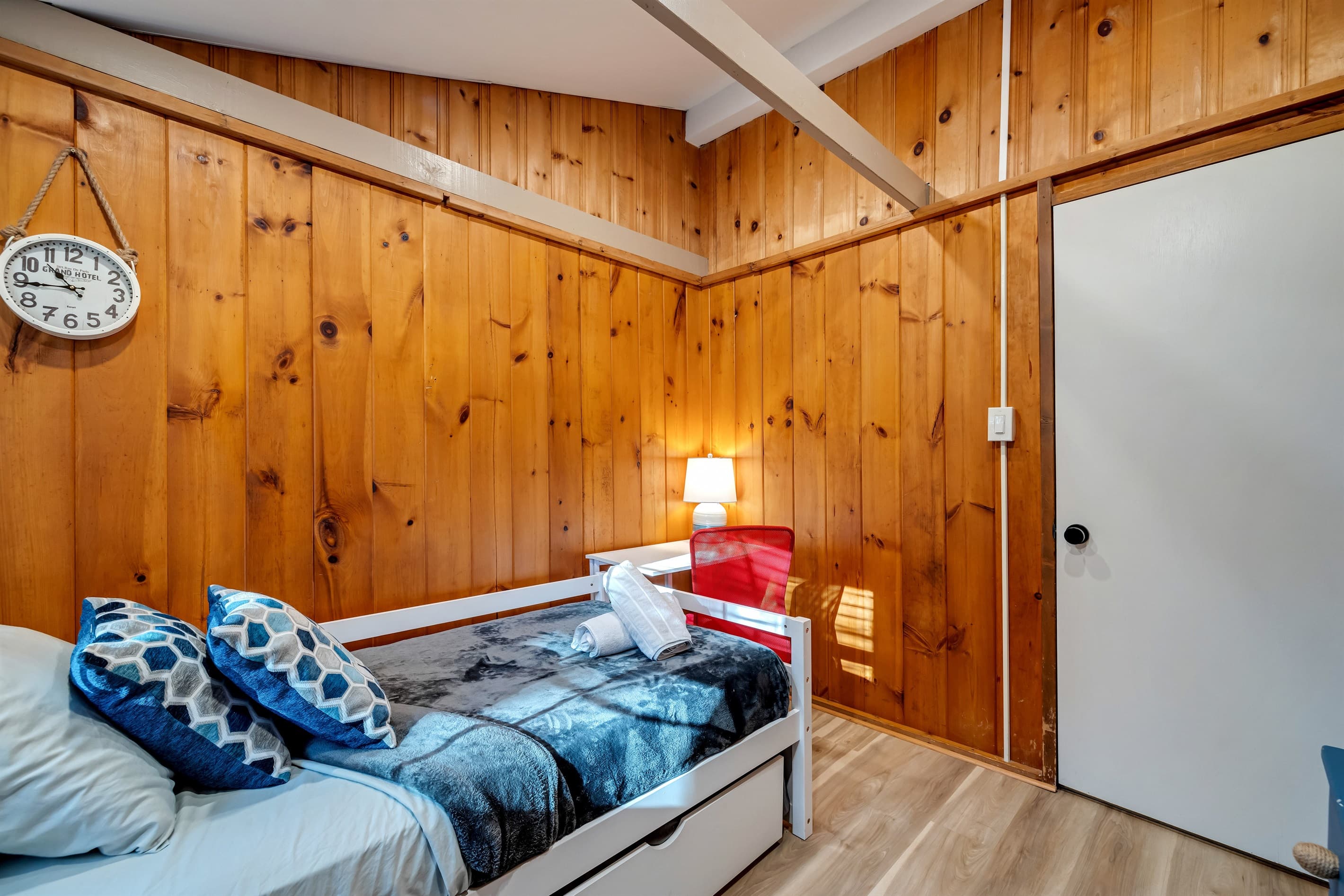 Cozy bedroom with a comfortable trundle bed, perfect for a restful night's sleep. A welcoming space for relaxation during your stay