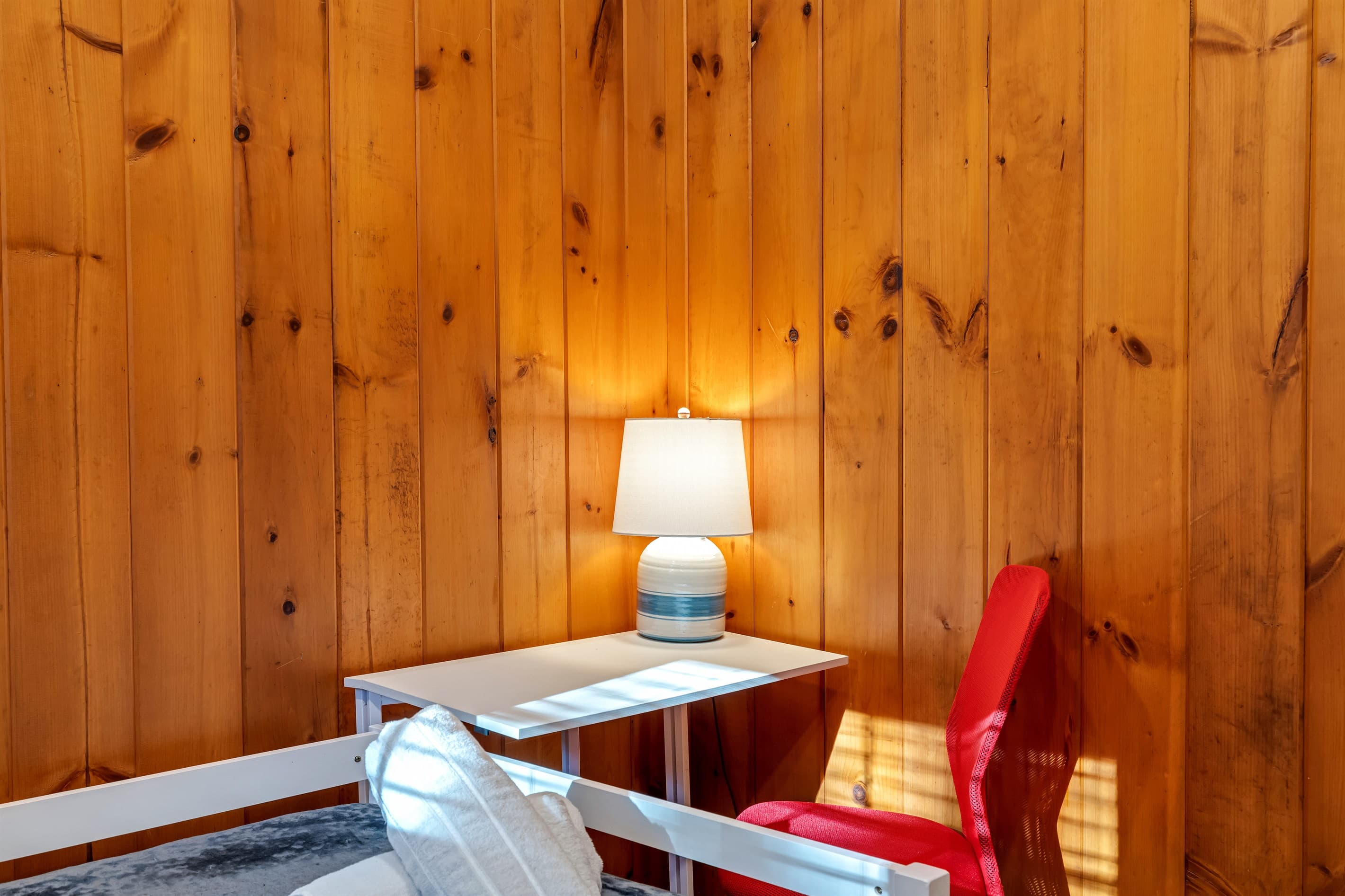 Small workspace with a desk and chair, ideal for laptop use and light work during your stay. A simple, functional spot to stay productive.