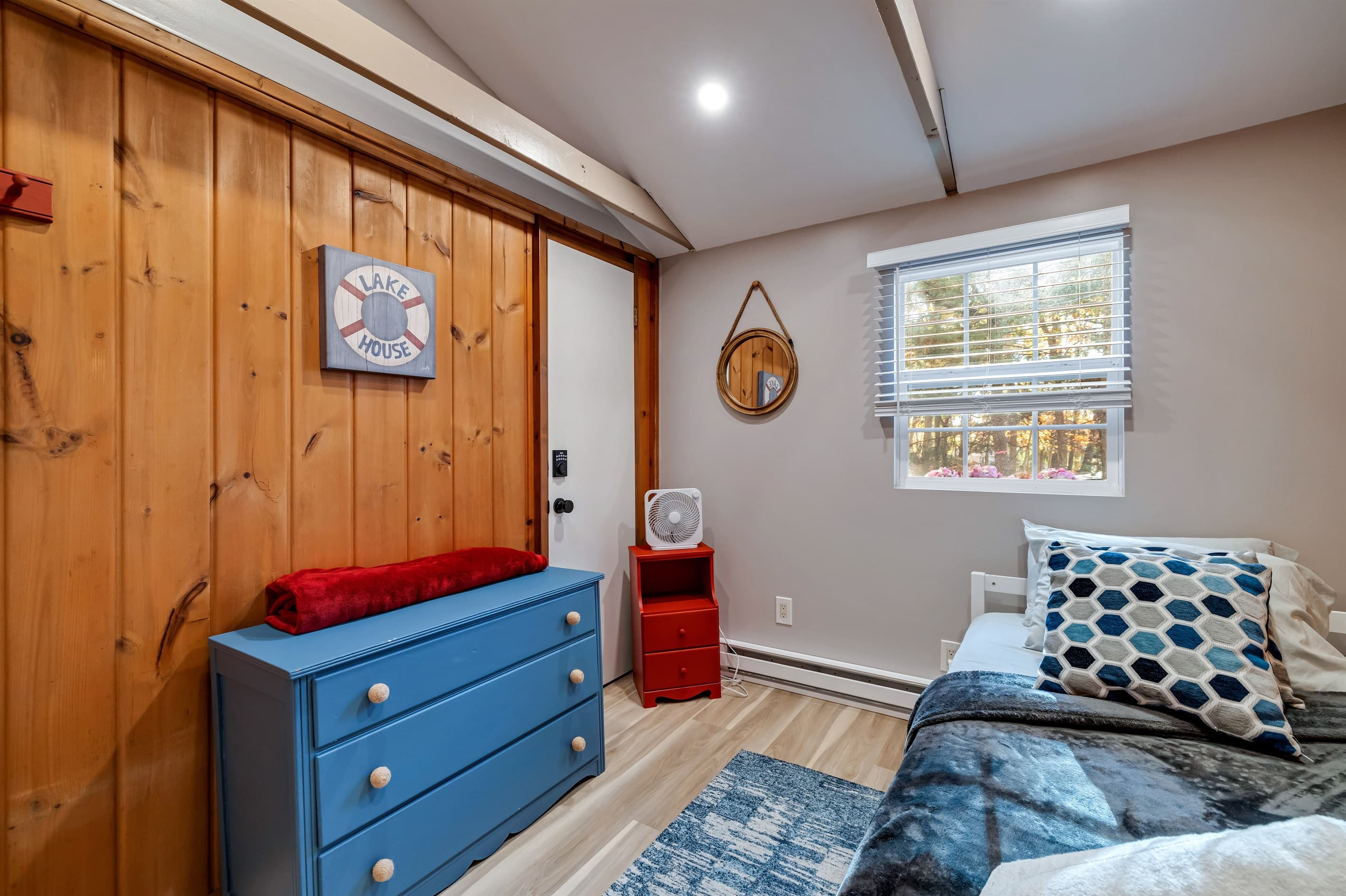 Cozy bedroom with a comfortable trundle bed, perfect for a restful night's sleep. A welcoming space for relaxation during your stay