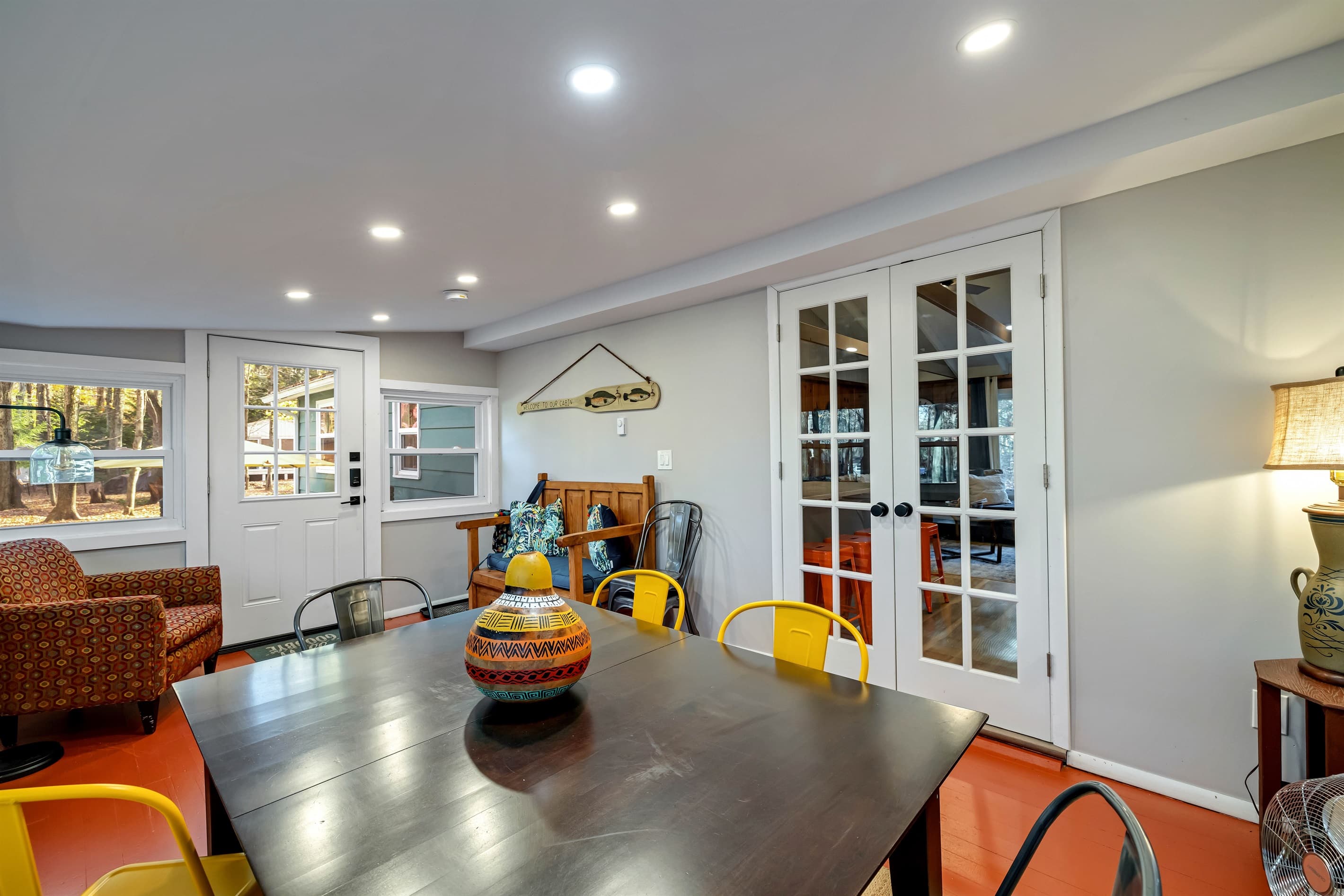 Sunroom featuring a dining table, perfect for enjoying meals while soaking in natural light and the surrounding views. A cozy spot to relax and dine!
