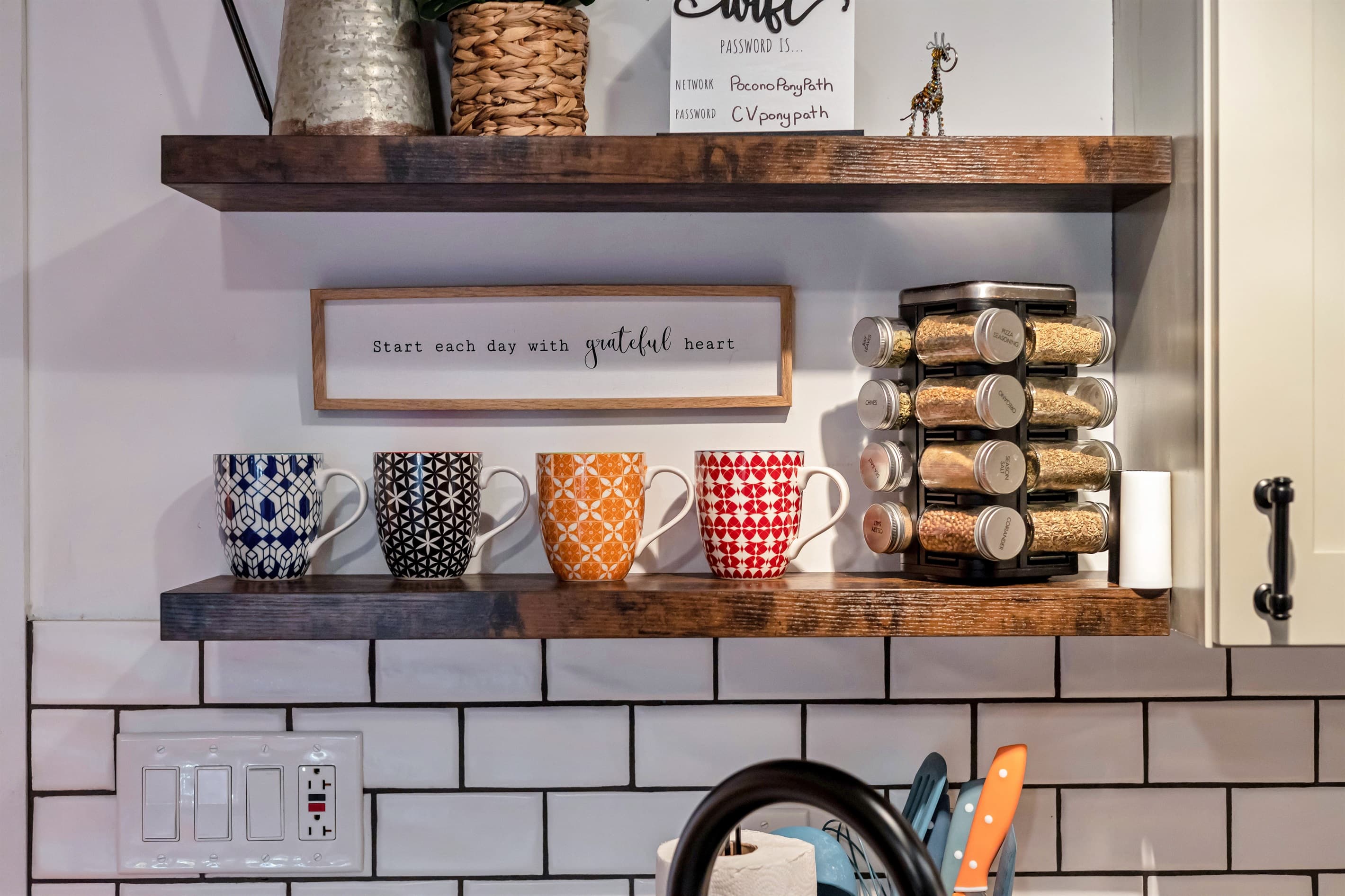 Modern kitchen with sleek quartz countertops, stainless steel appliances, and a breakfast counter, offering a stylish and functional space for cooking and dining | Serhii Vacation Rentals