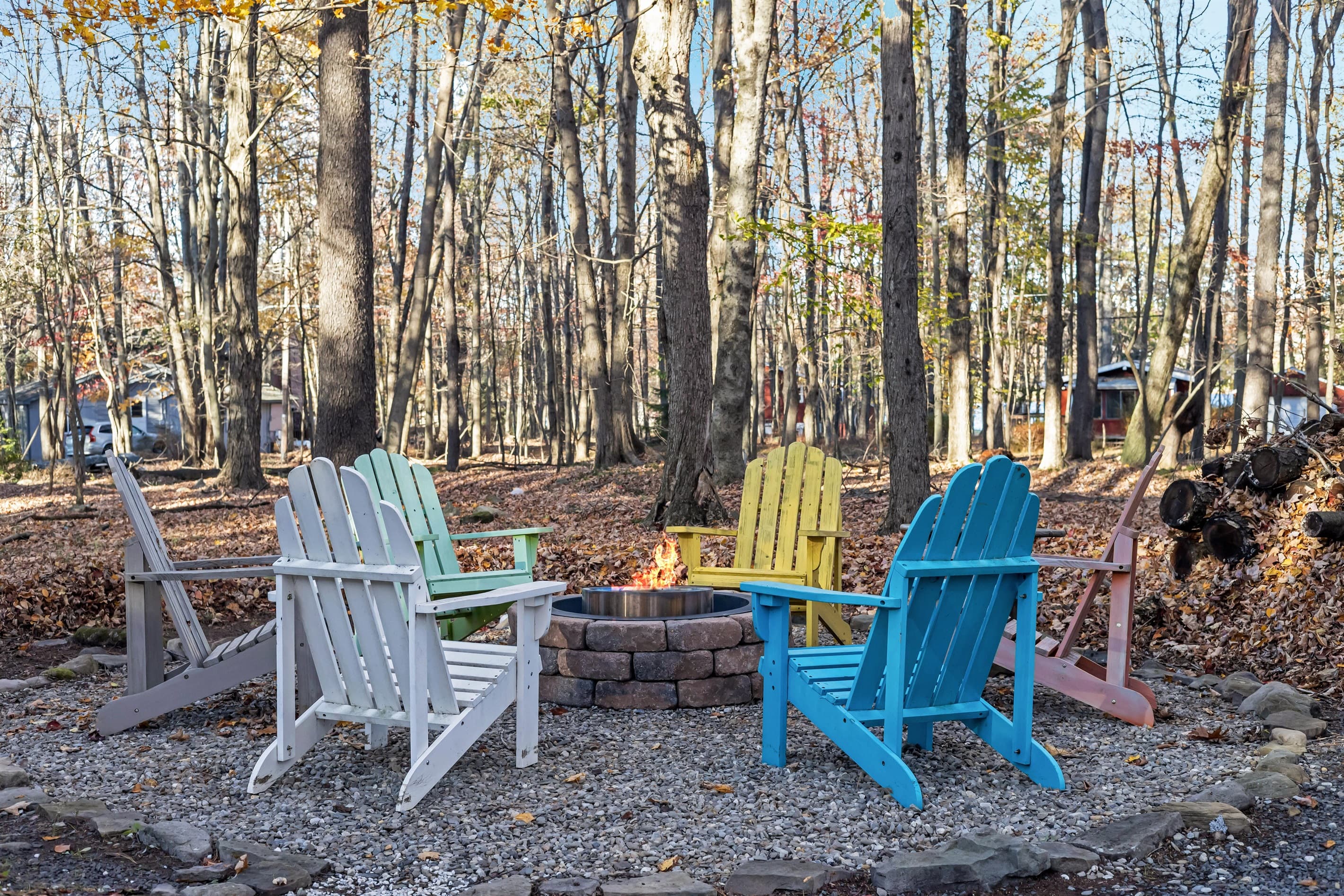 Outdoor firepit surrounded by Adirondack-style chairs, perfect for cozy evenings by the fire, sharing stories, and enjoying the fresh mountain air with friends and family