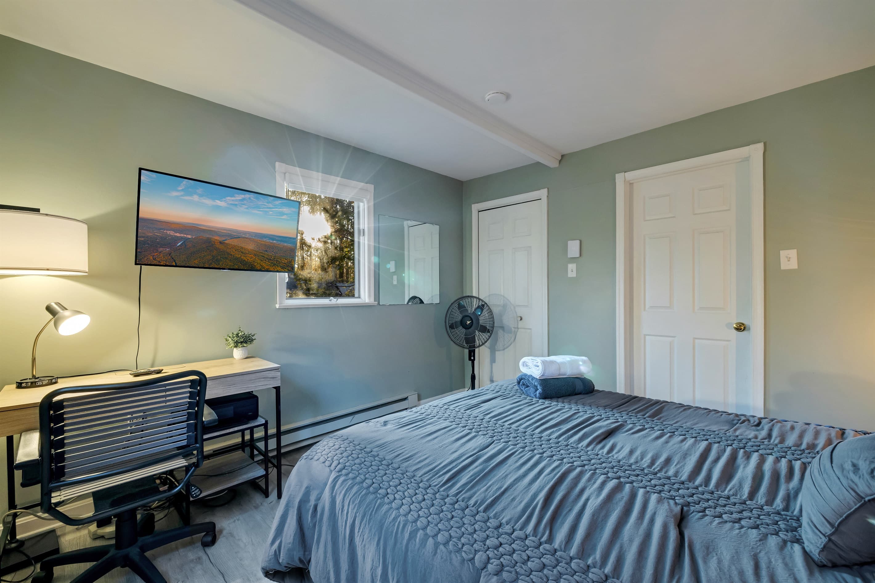 Bedroom featuring a queen-size bed and TV, offering a comfortable and relaxing space for restful nights and entertainment