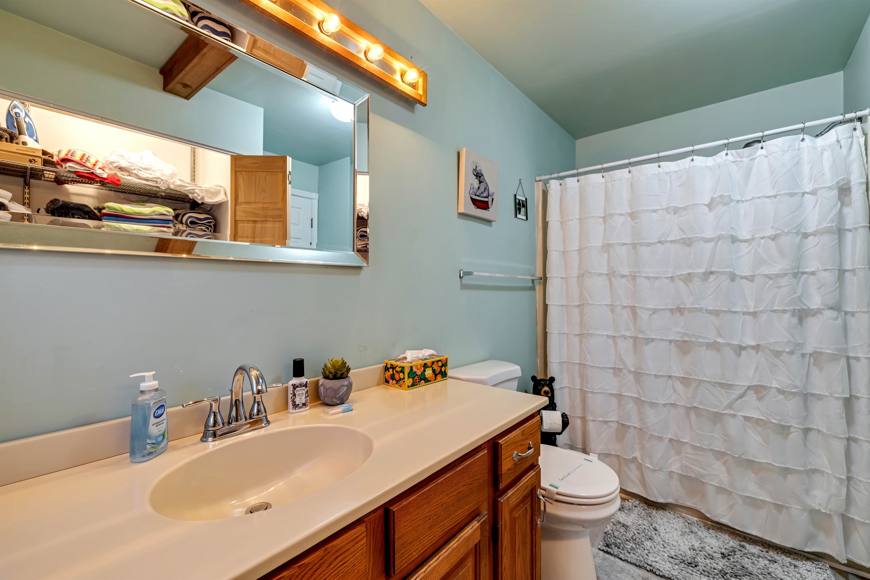 Full bathroom featuring a relaxing tub, perfect for unwinding after a long day. Enjoy a soothing soak in a serene and inviting space