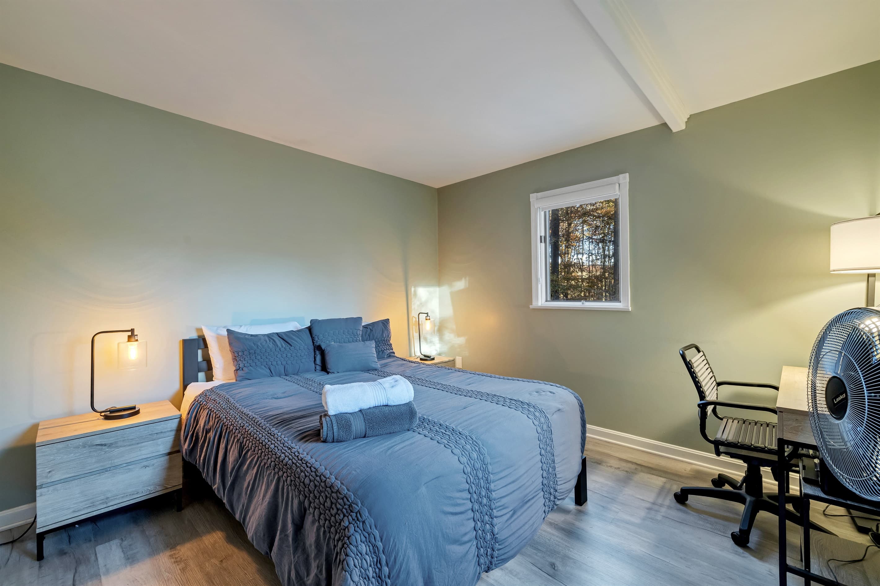 Bedroom featuring a queen-size bed and TV, offering a comfortable and relaxing space for restful nights and entertainment