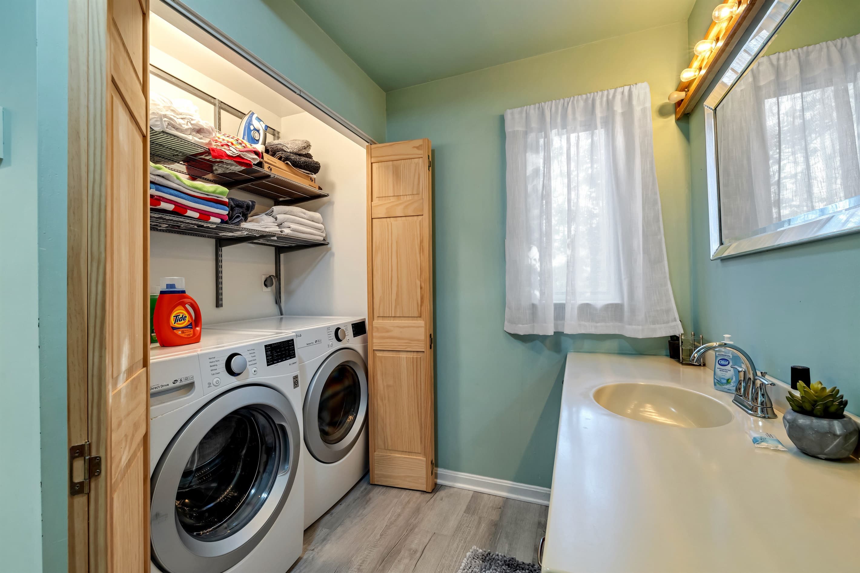 Convenient laundry area located in one of the bathrooms, featuring a washer and dryer for easy access during your stay
