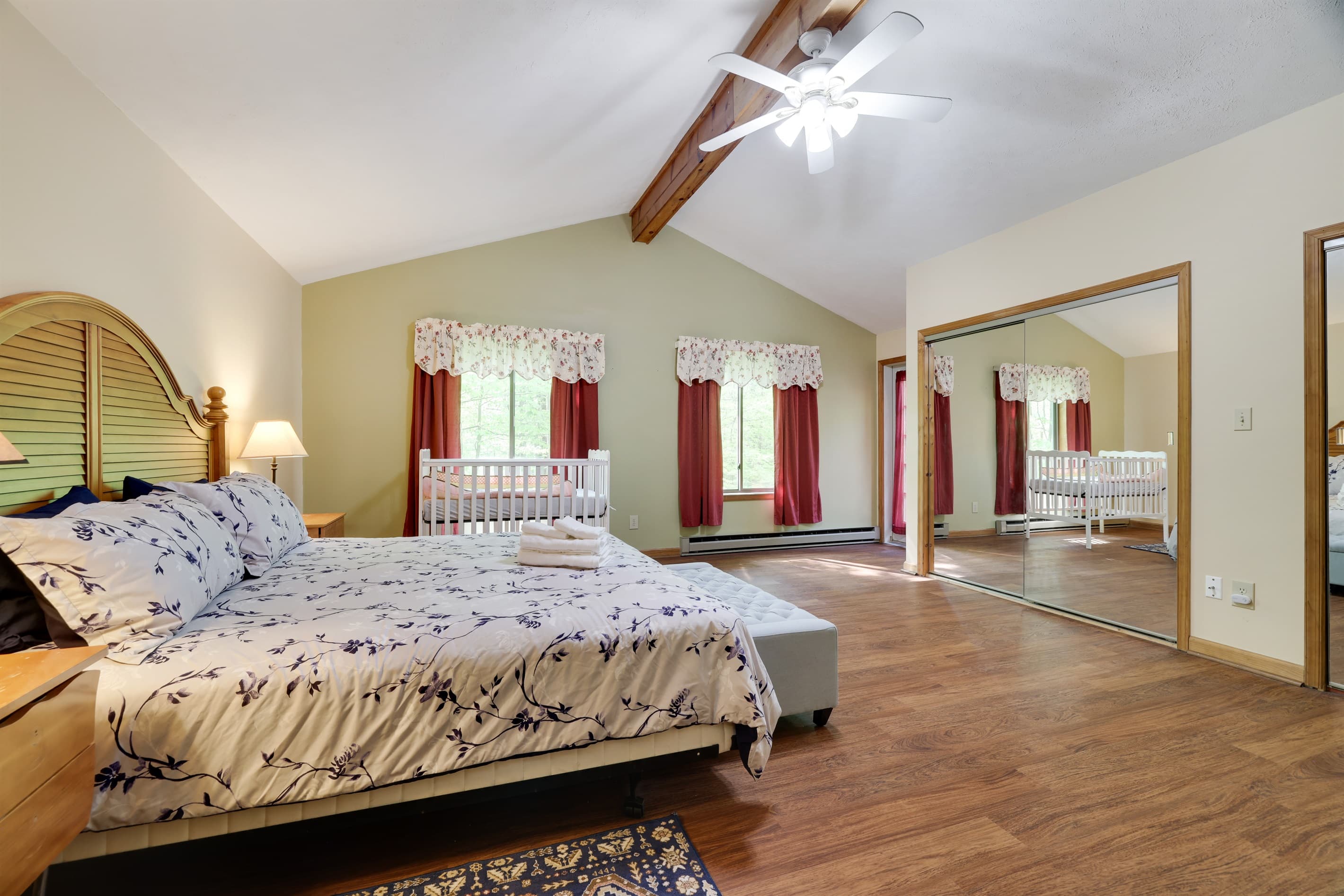 Master bedroom with king size bed and 2 cribs