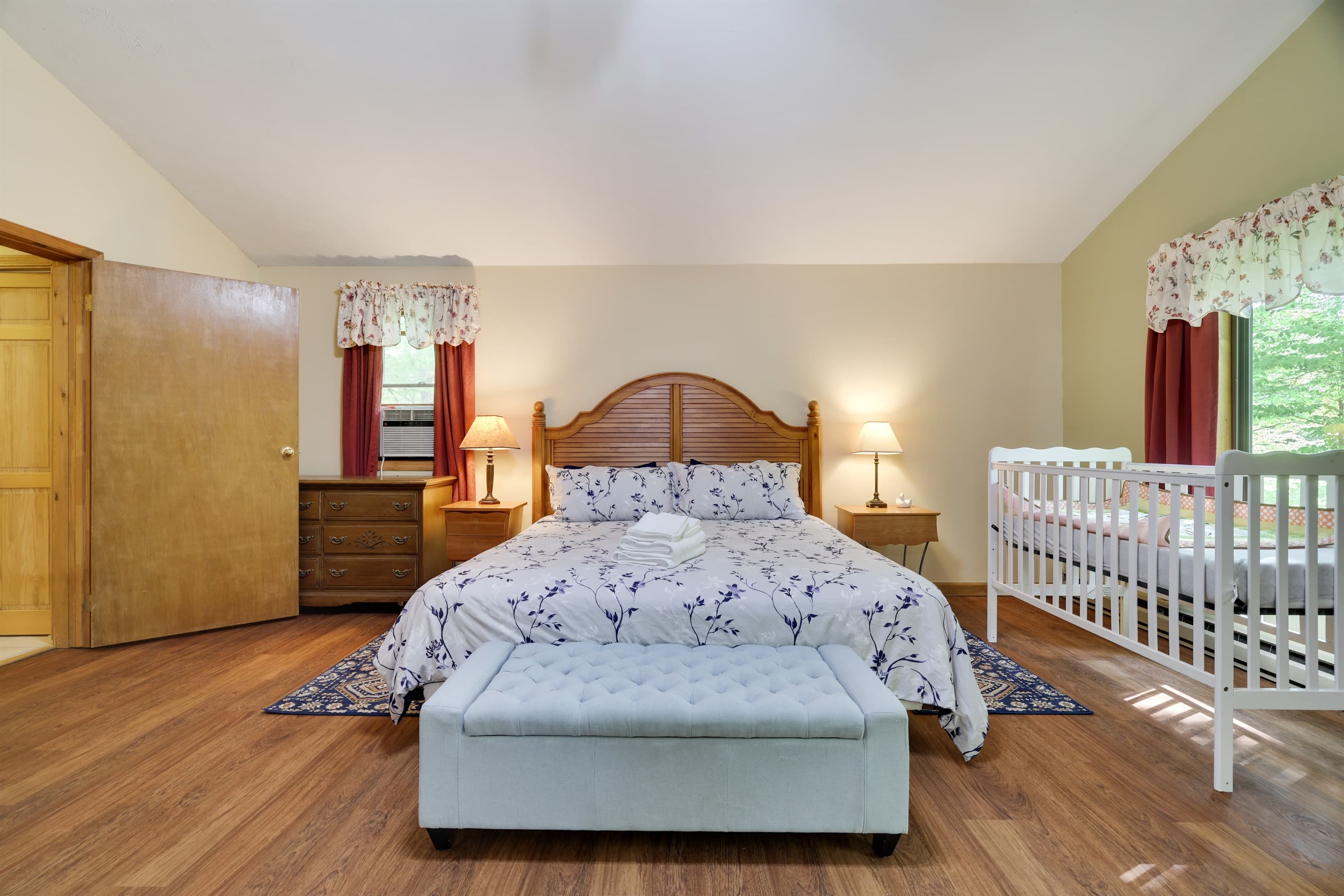 Master bedroom with king size bed and 2 cribs
