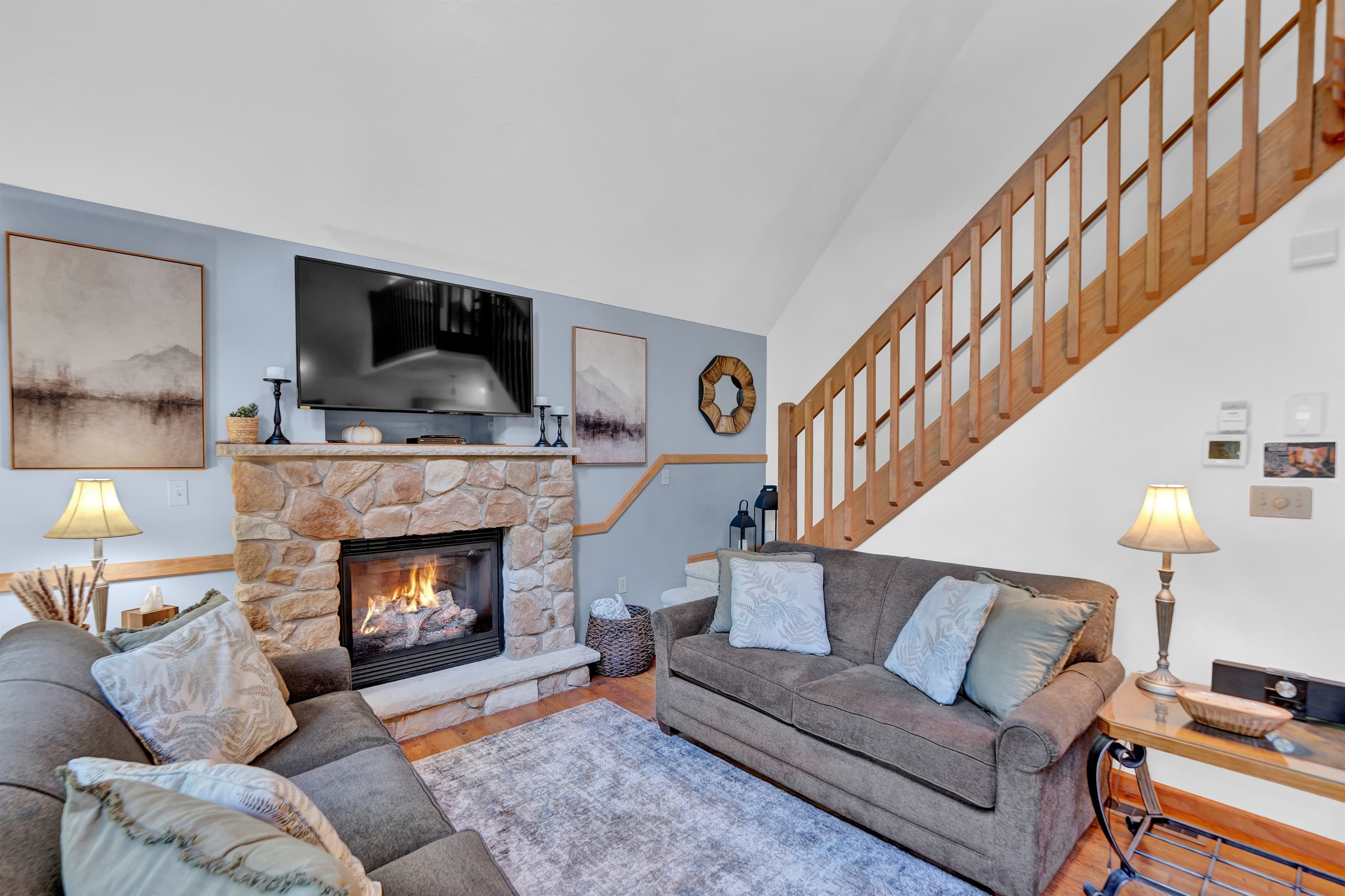 Living room with TV, propane fireplace and comfortable seating