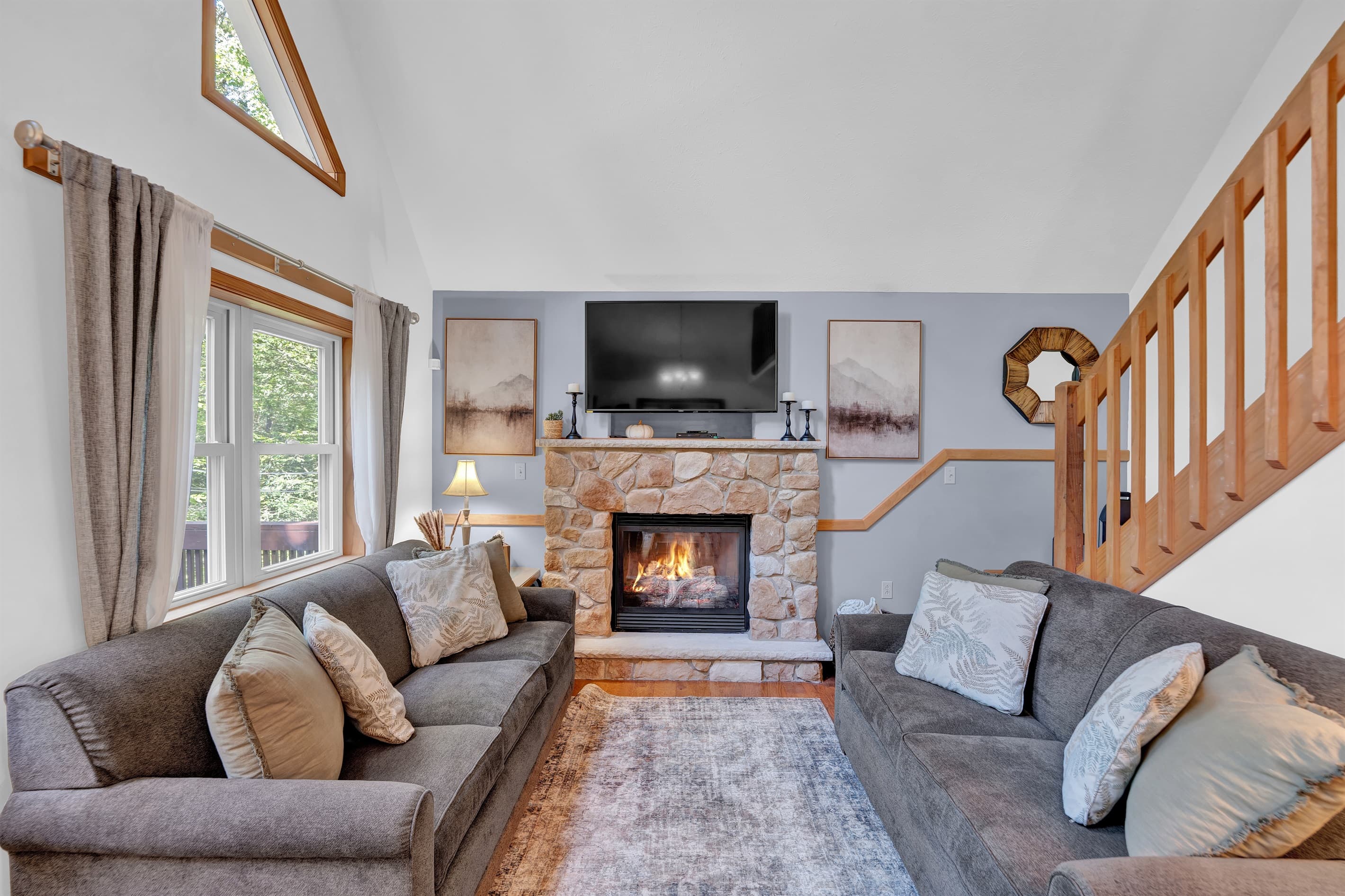 Living room with TV, propane fireplace and comfortable seating