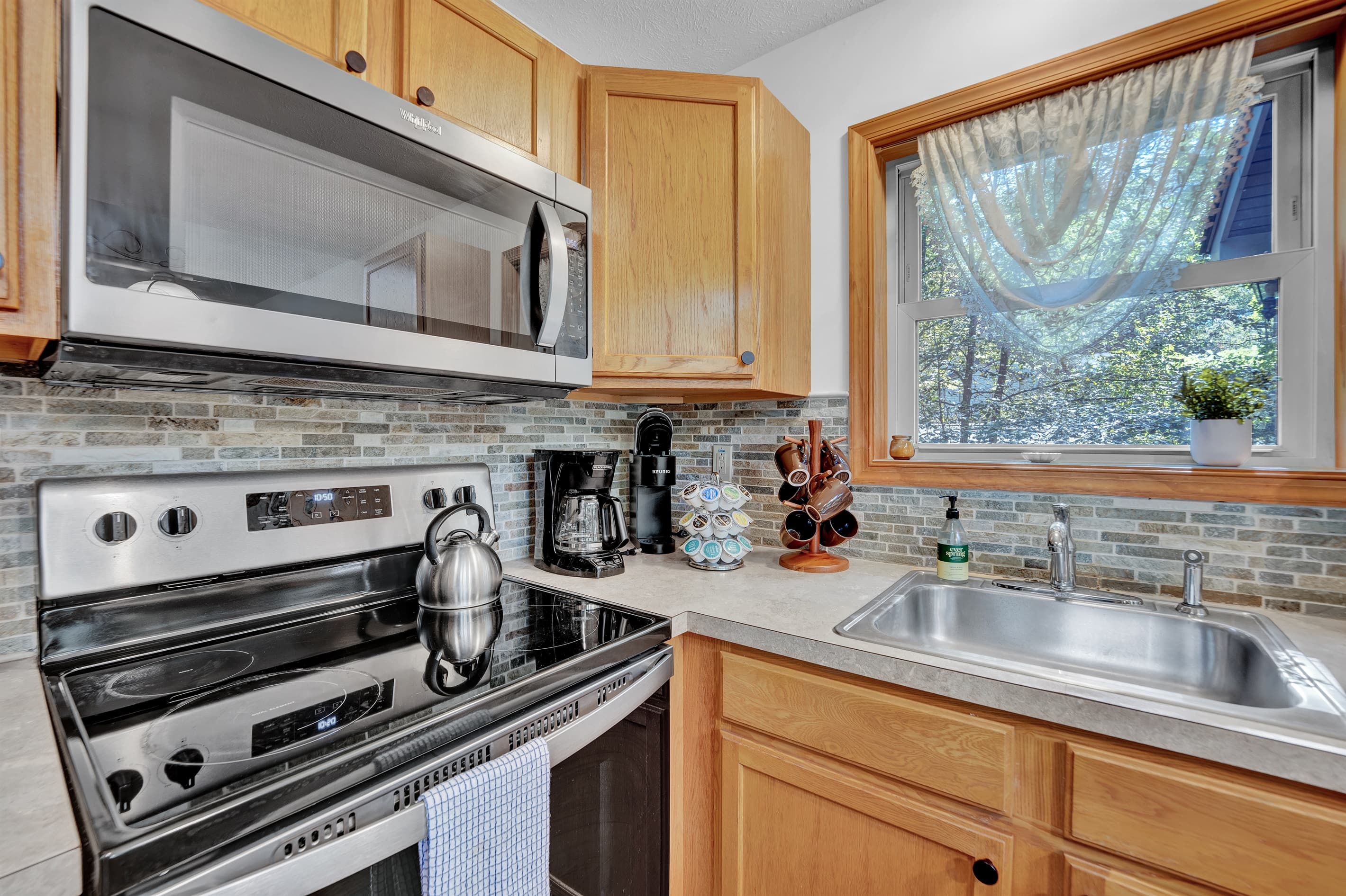 Fully stocked kitchen with stainless appliances