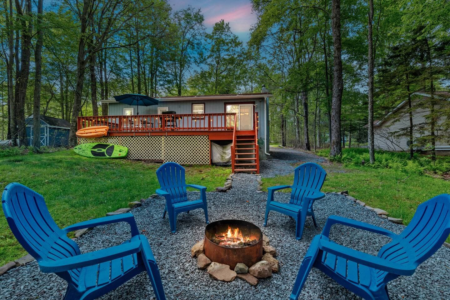Inviting outdoor area with firepit and seating—perfect for s’mores and stories