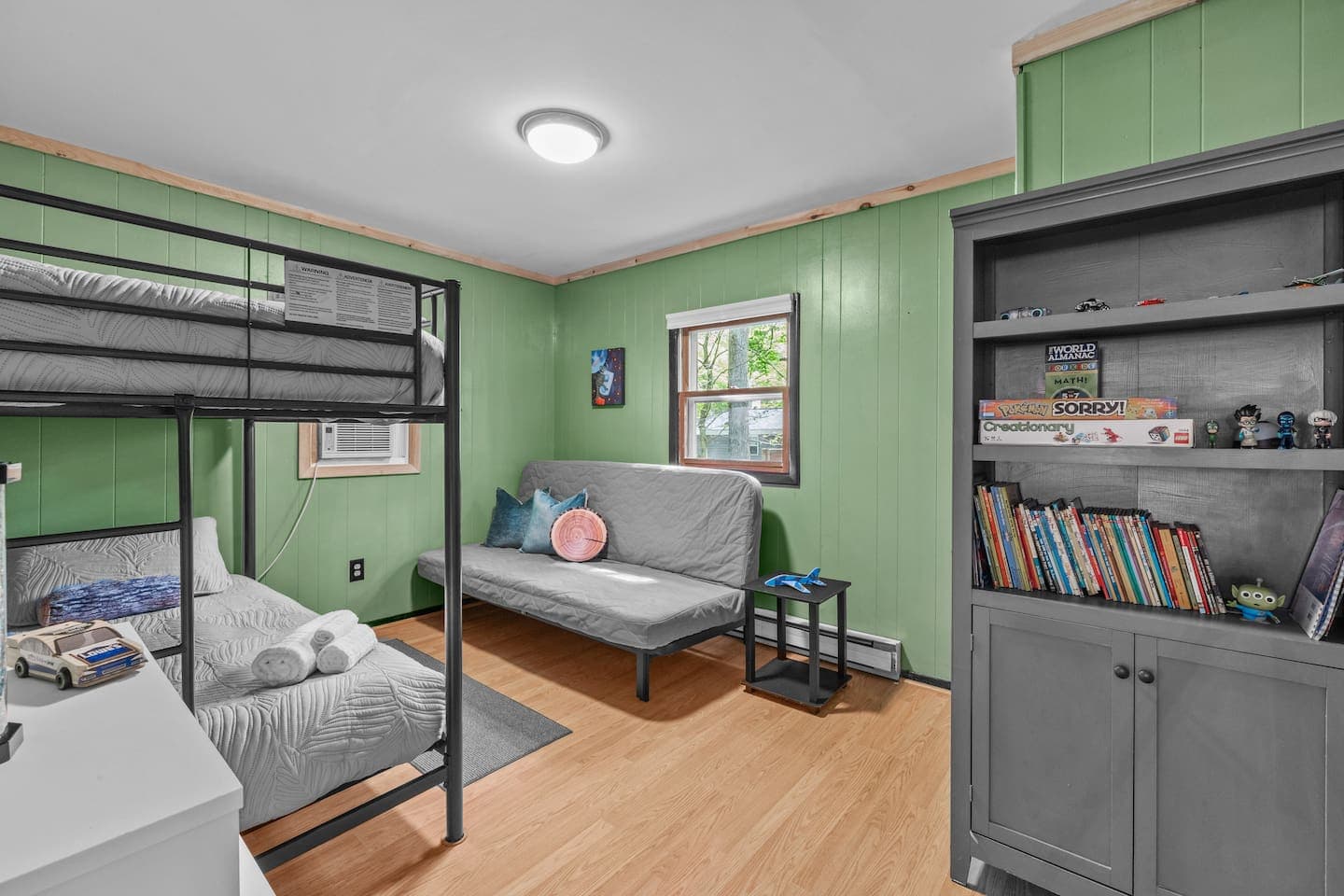 Kid-friendly room with a twin bunk bed and a full-size futon for extra sleeping space