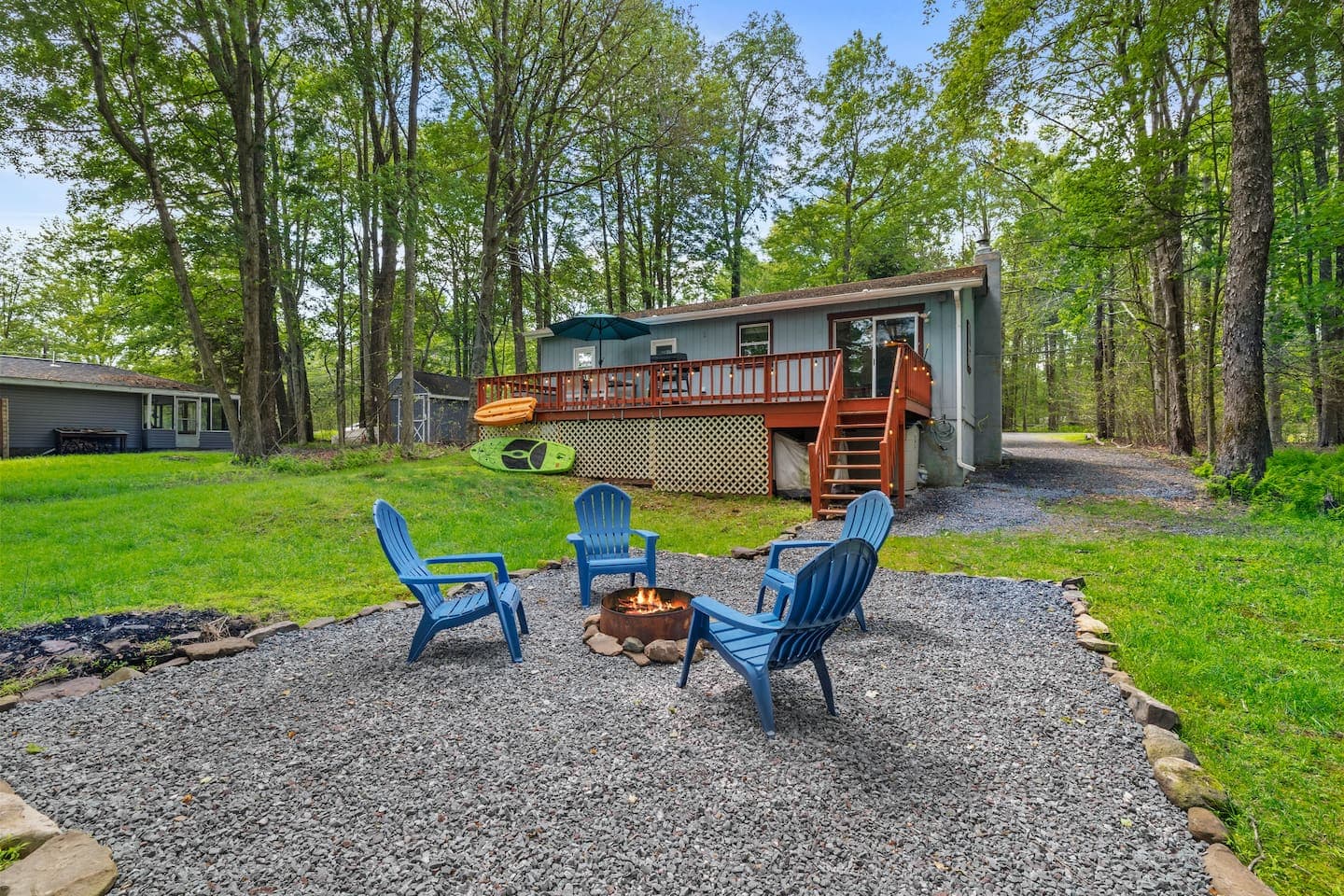 Inviting outdoor area with firepit and seating—perfect for s’mores and stories