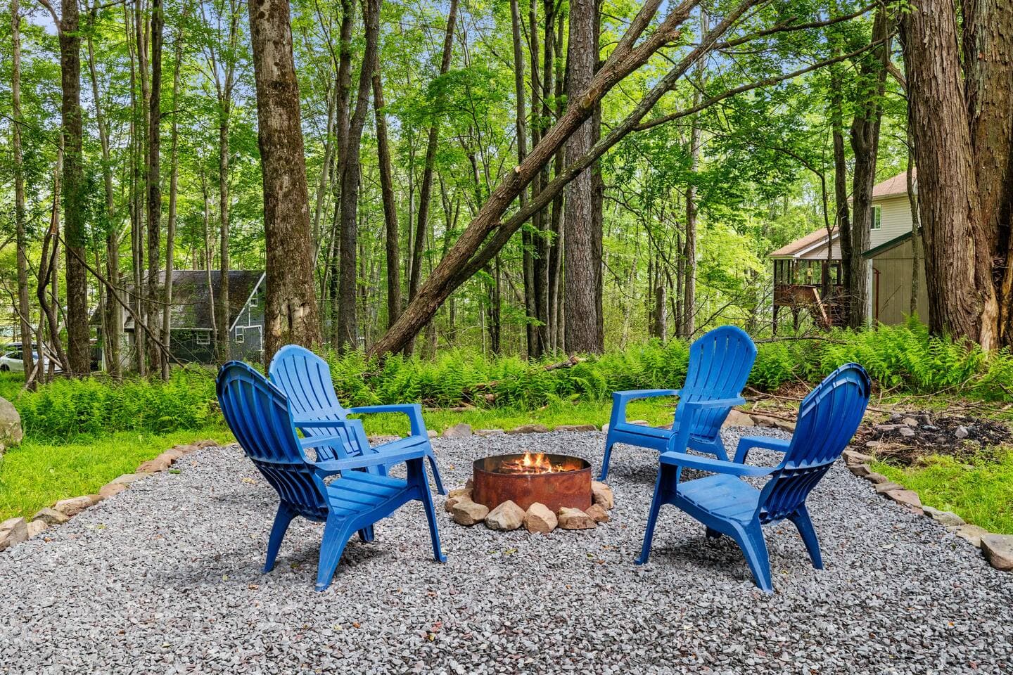 Inviting outdoor area with firepit and seating—perfect for s’mores and stories