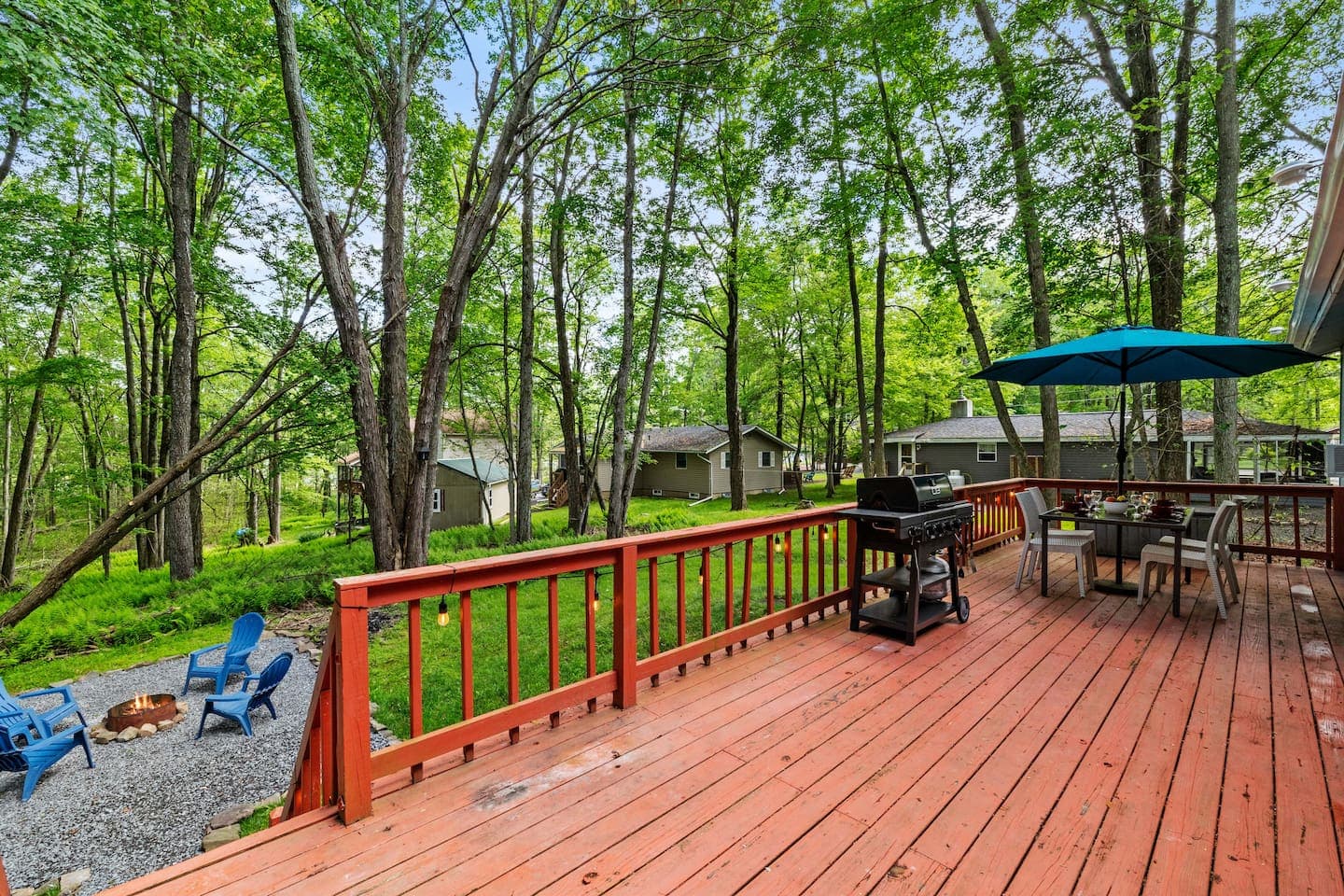 Spacious deck with dining table and propane grill—perfect for outdoor meals