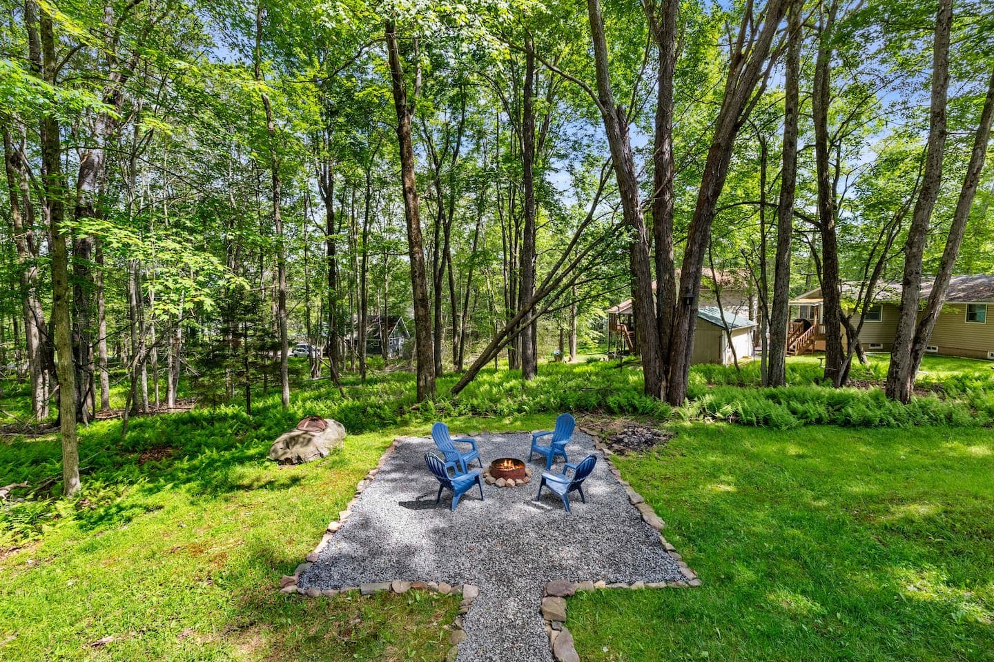 Inviting outdoor area with firepit and seating—perfect for s’mores and stories